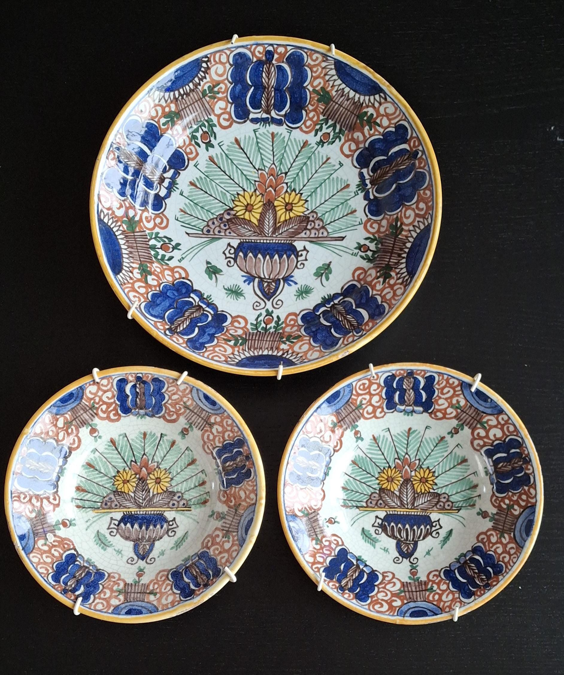Antique peacock wall plates, 19th century Delftware