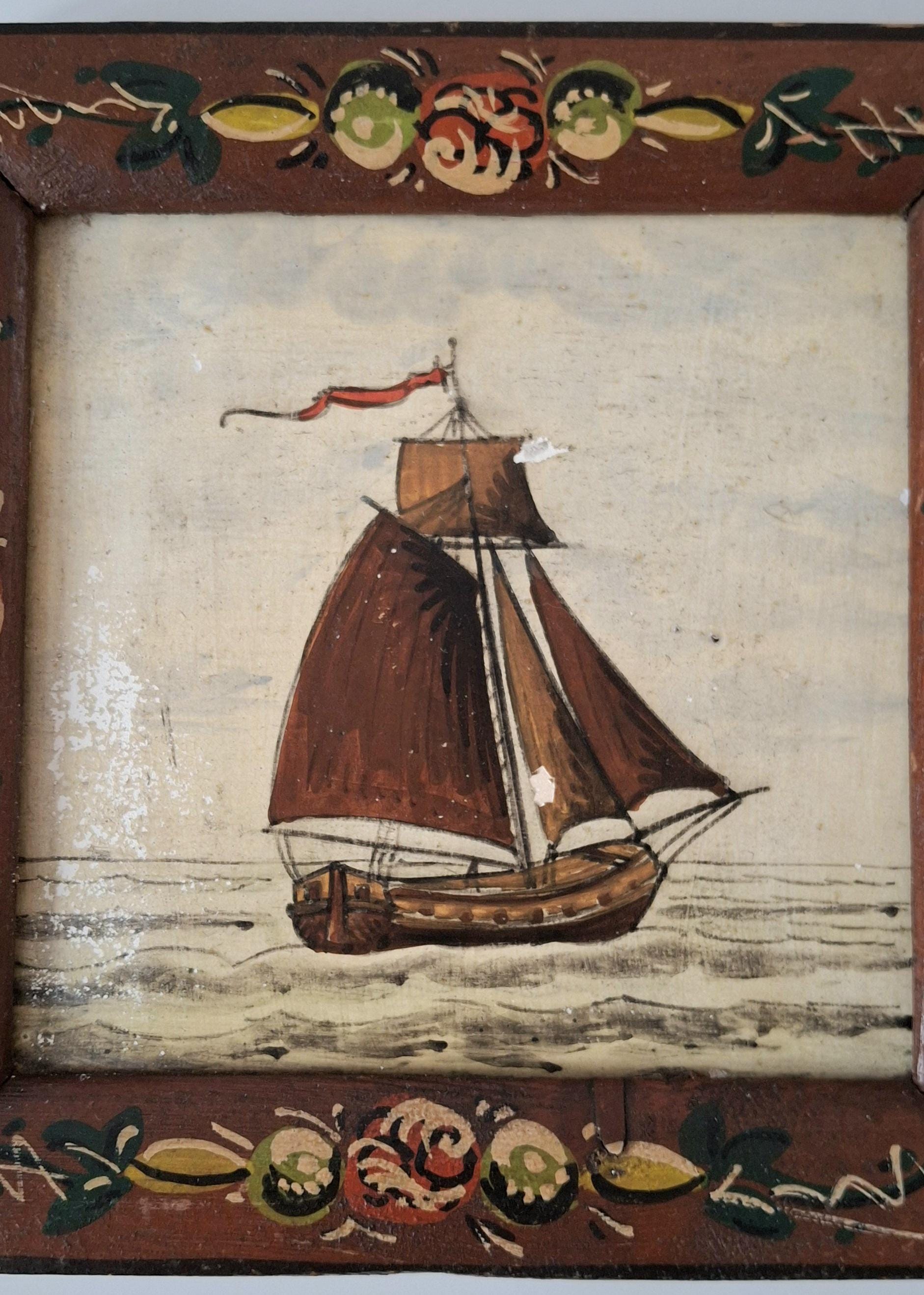 Decorative framed Dutch tile with a sailboat image