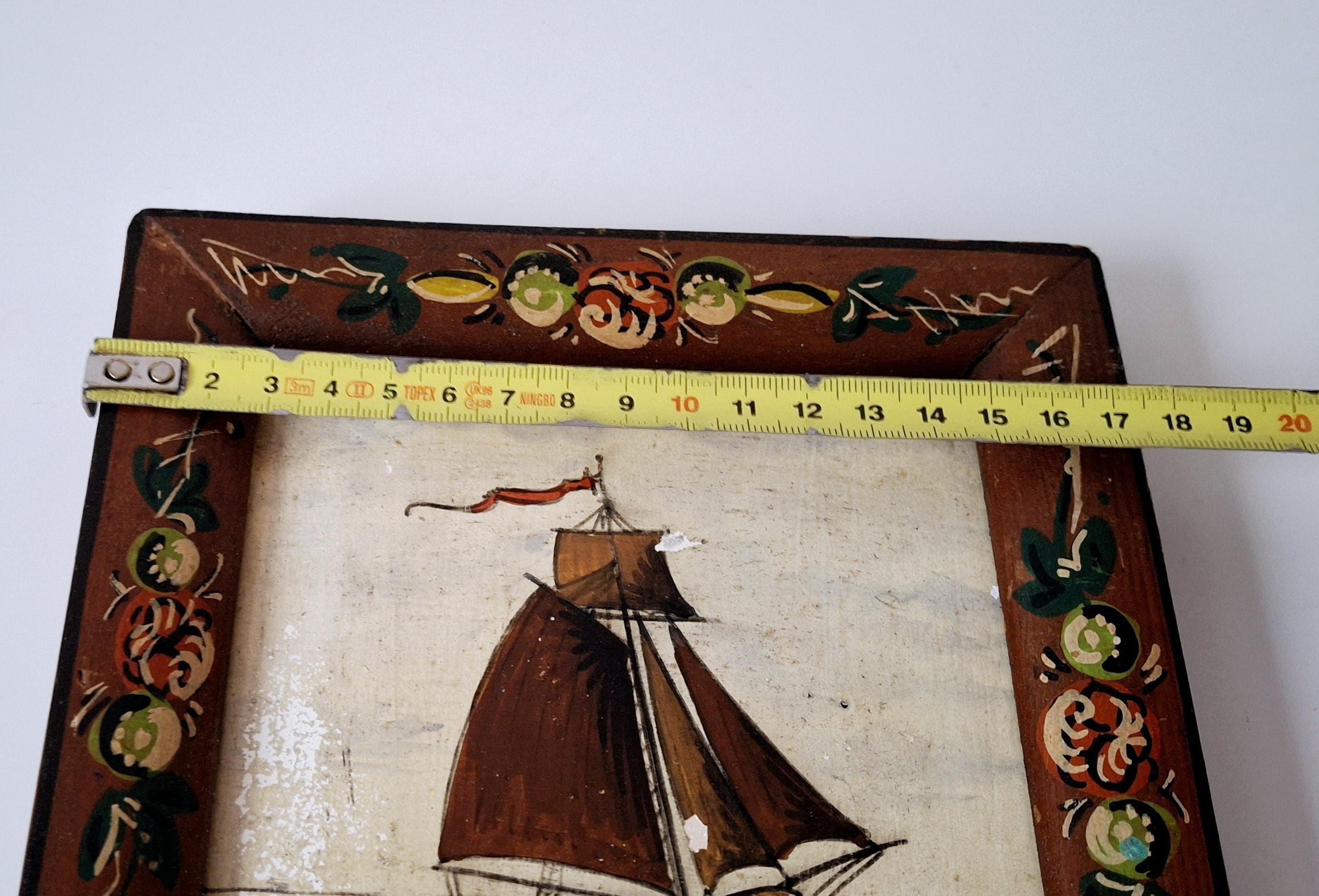 Decorative framed Dutch tile with a sailboat image