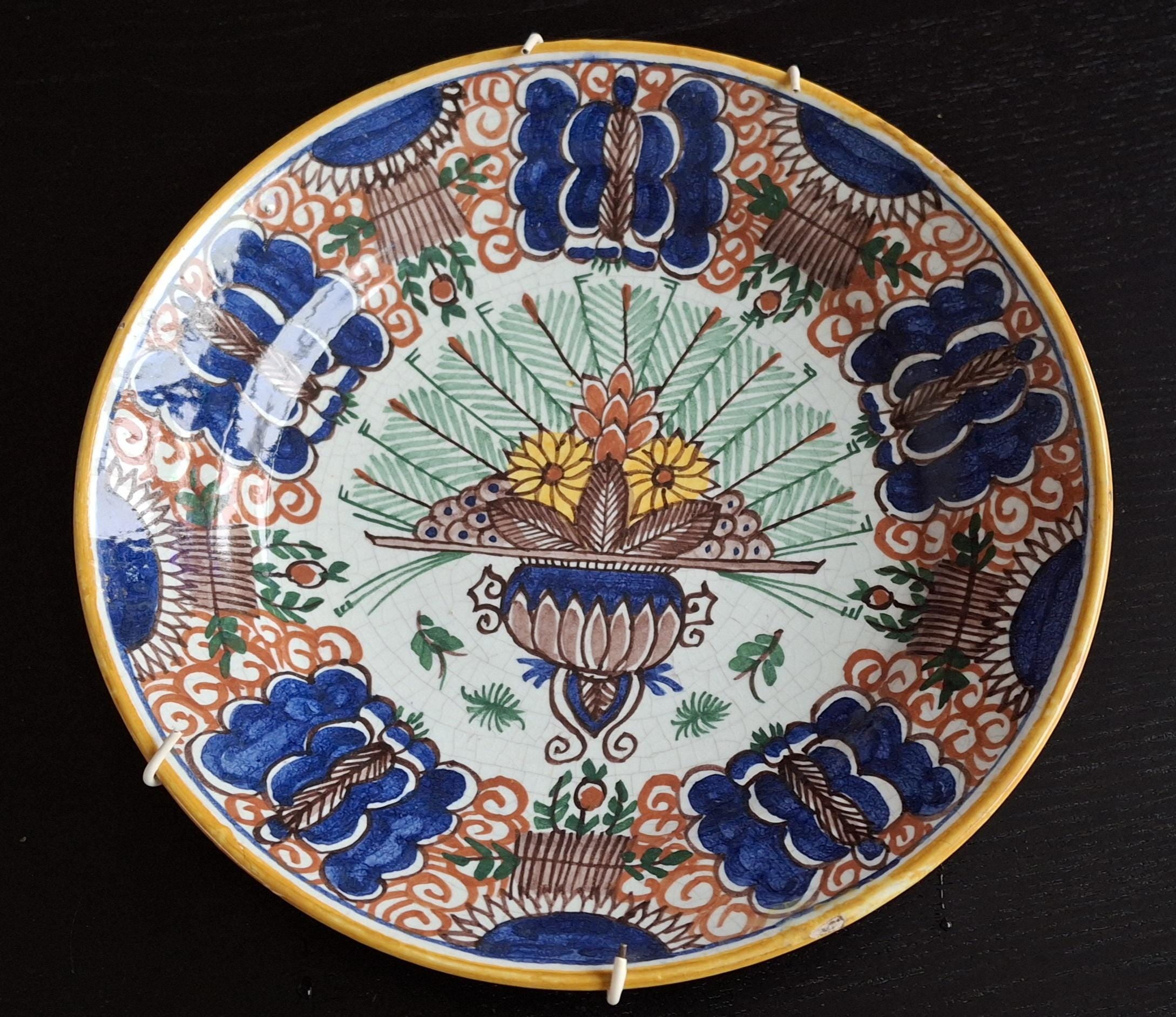 Antique peacock wall plates, 19th century Delftware