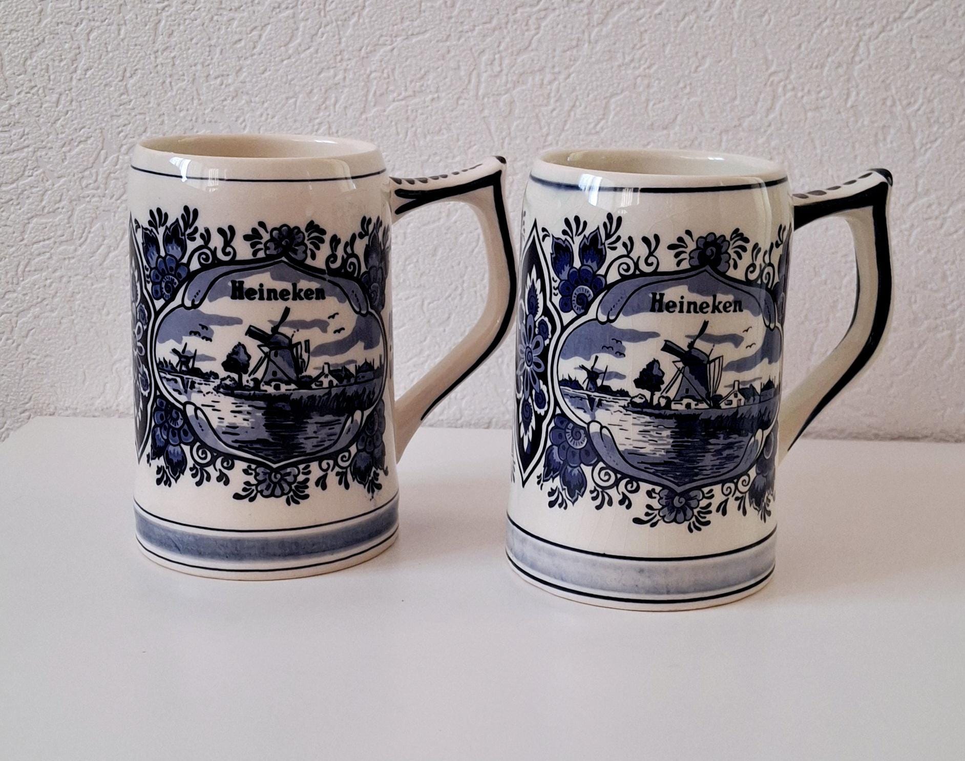 Pair of vintage Heineken Delft Blue beer mugs, Dutch beer steins