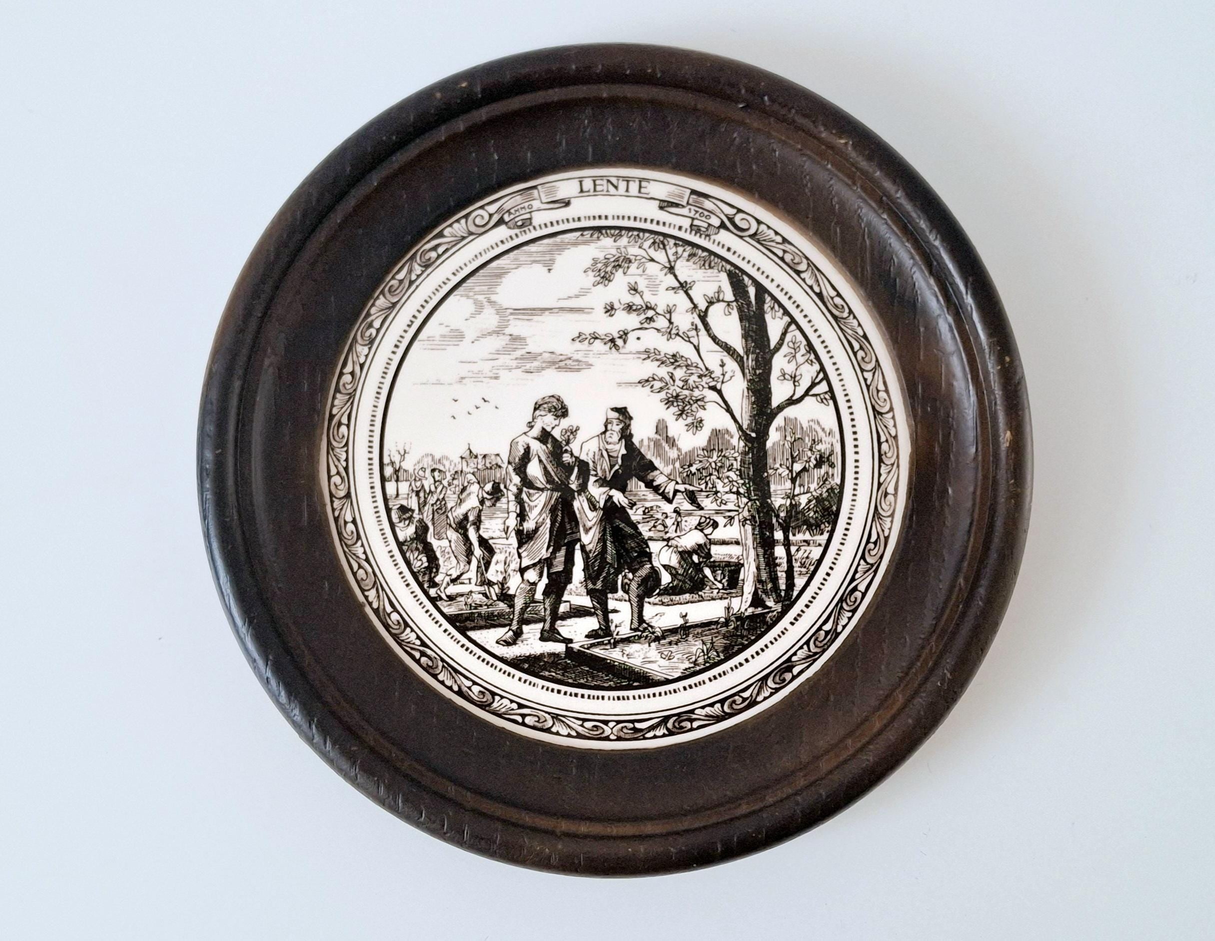 Set of 4 seasonal ceramic tiles in round wooden frames