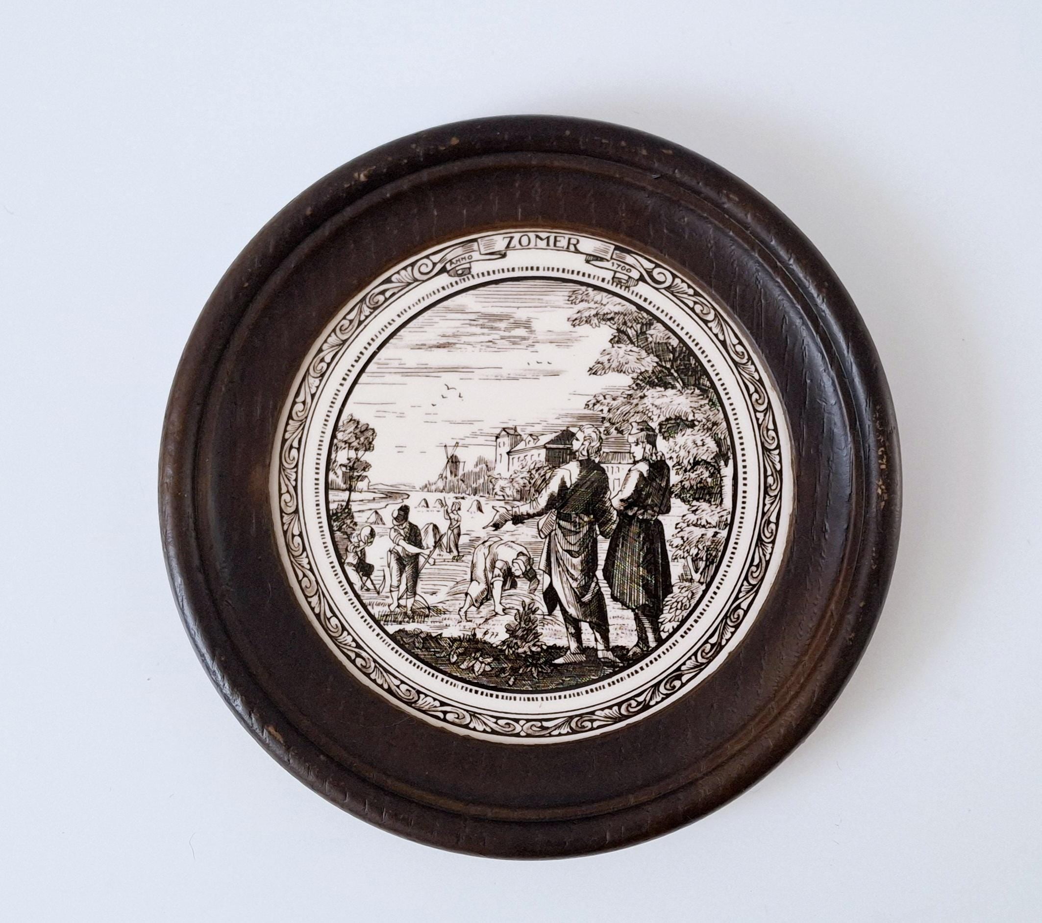 Set of 4 seasonal ceramic tiles in round wooden frames