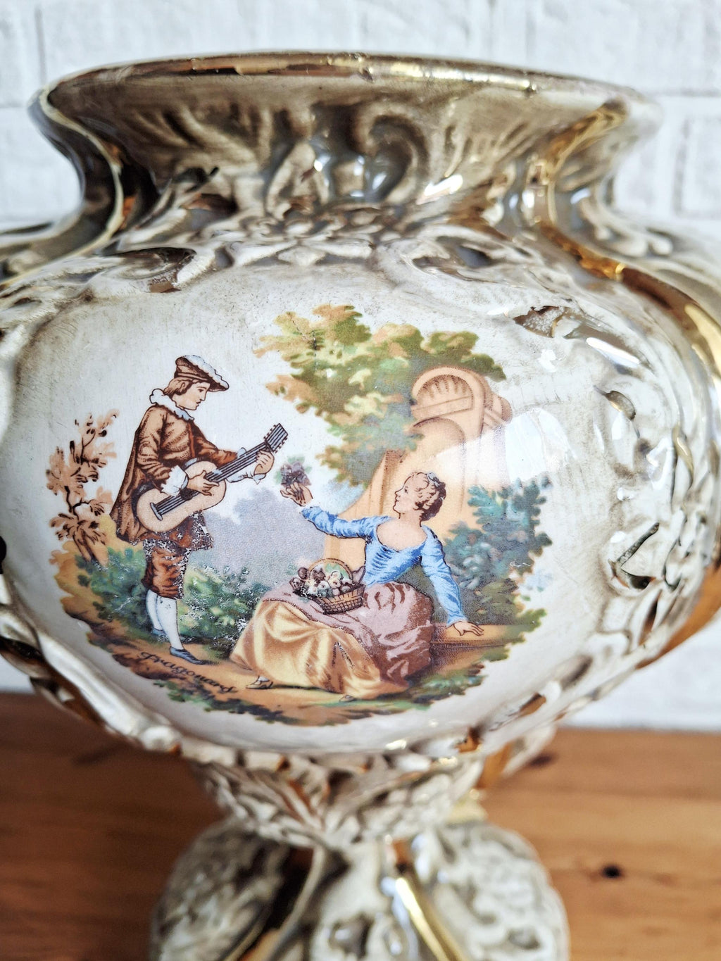 Italian rococo revival lidded vase with floral reliefs and gold accents