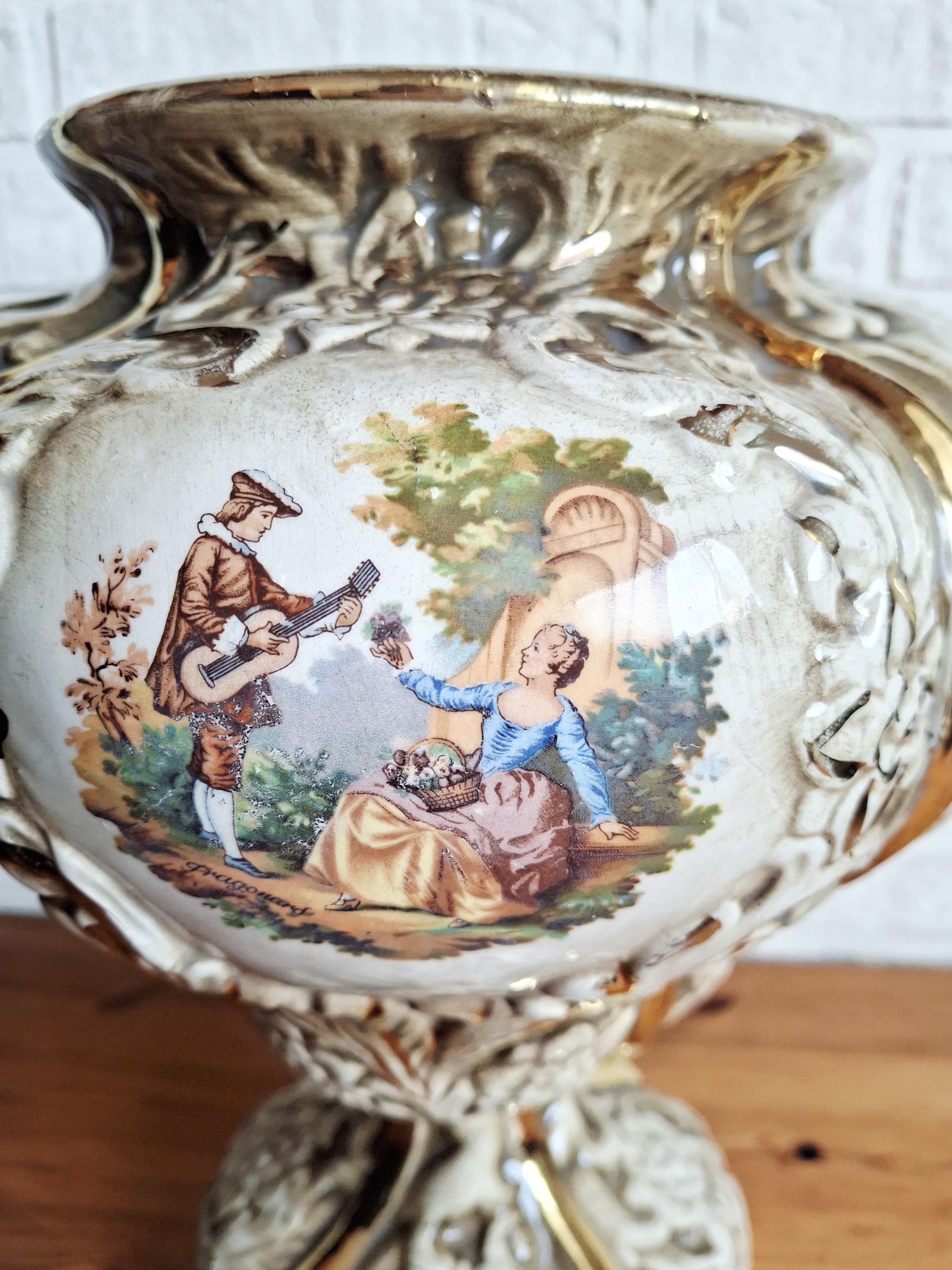 Italian rococo revival lidded vase with floral reliefs and gold accents
