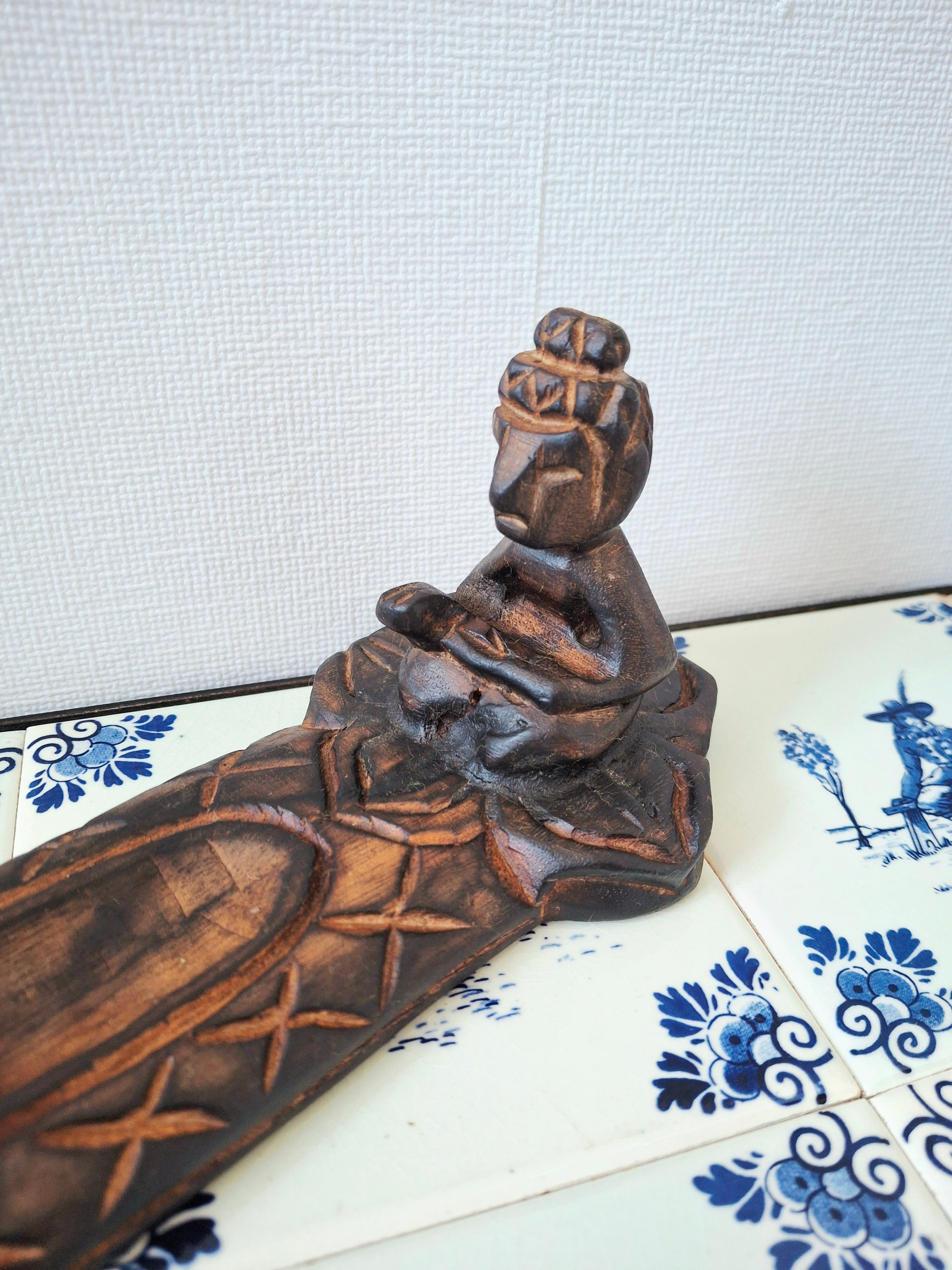 Wooden meditative figure incense holder