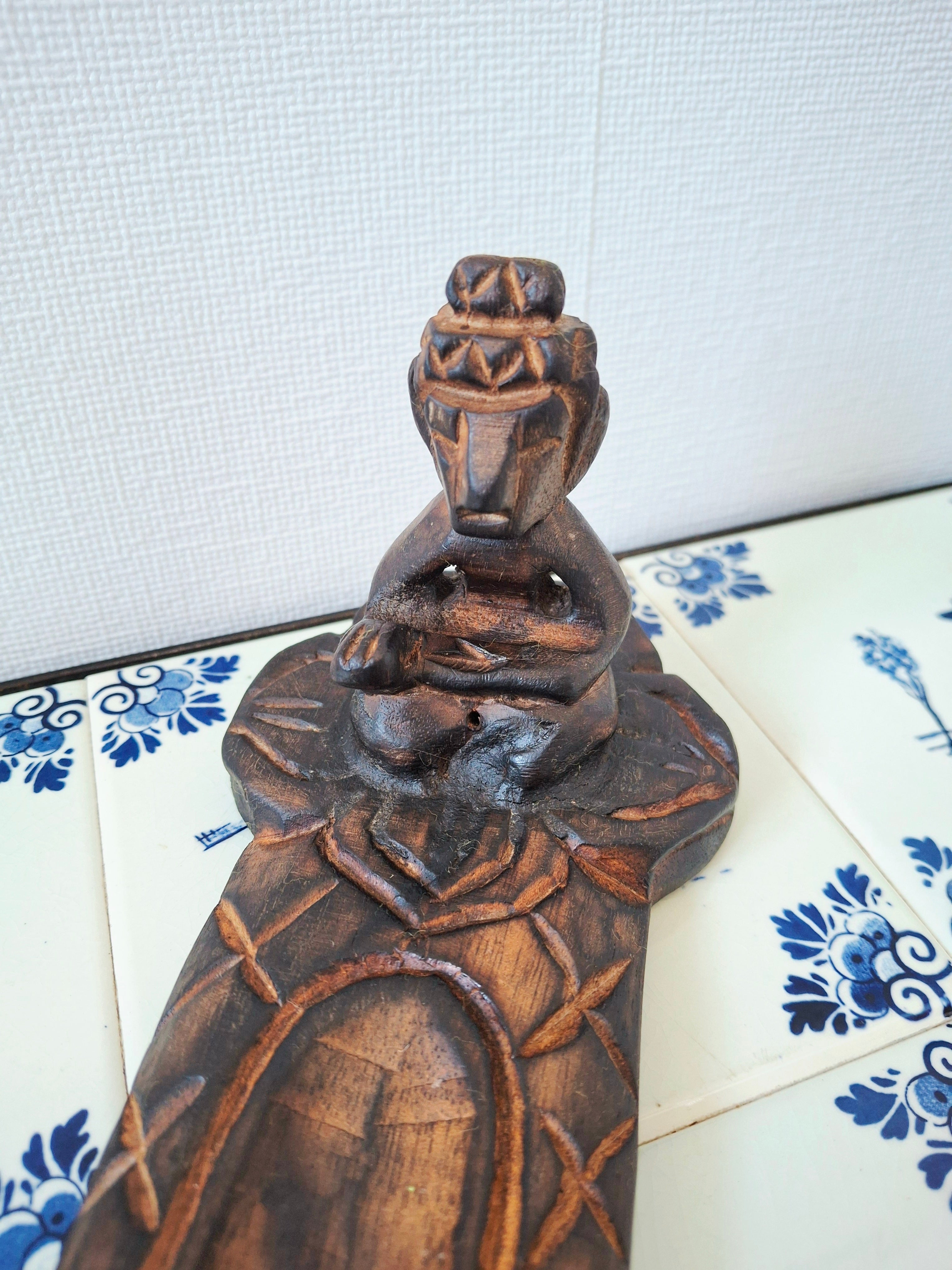 Wooden meditative figure incense holder