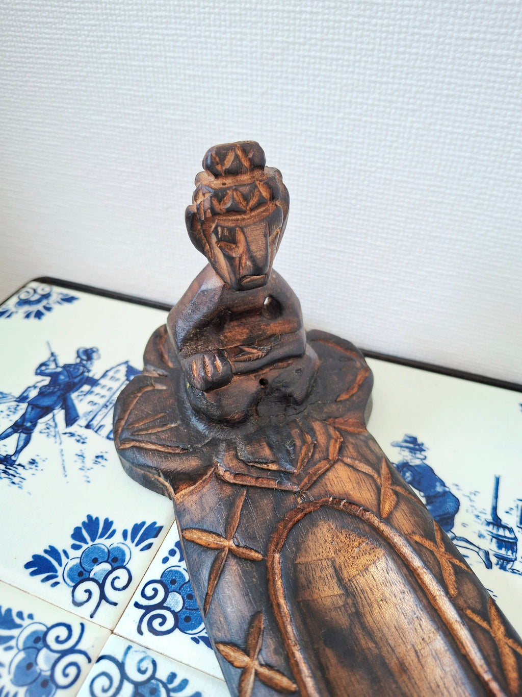 Wooden meditative figure incense holder