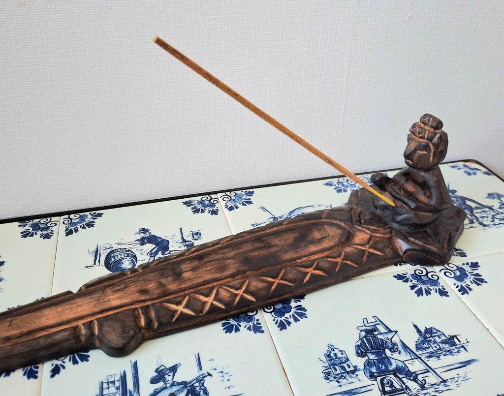 Wooden meditative figure incense holder