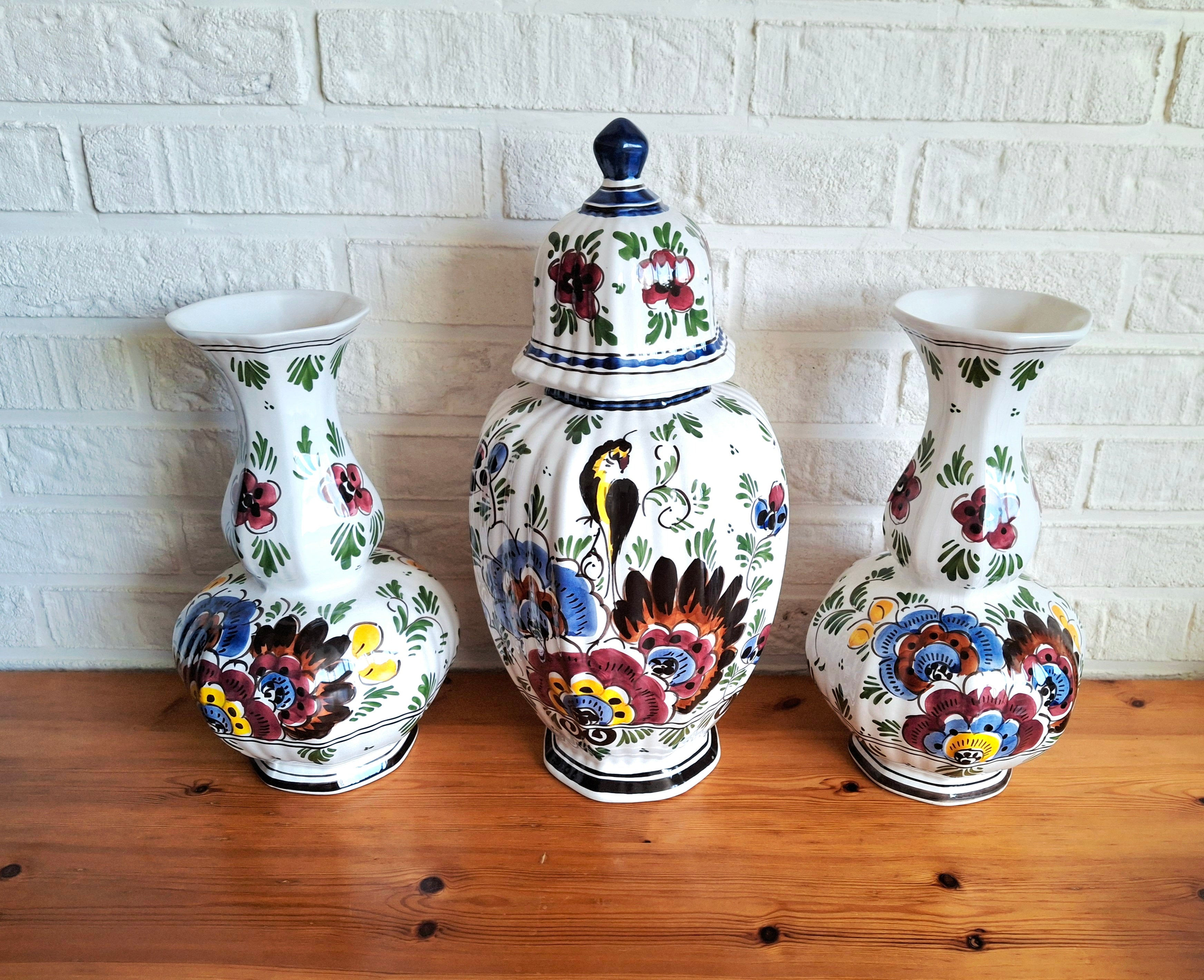 Three hand-painted Delft porcelain vases, cabinet set with colored floral pattern, Delft Earthenware Holland