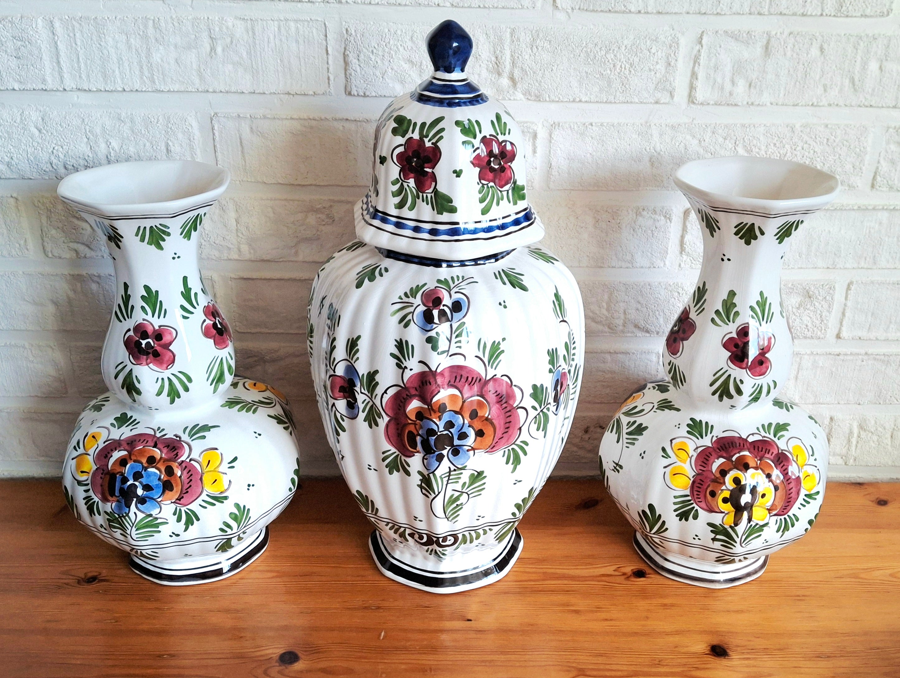 Three hand-painted Delft porcelain vases, cabinet set with colored floral pattern, Delft Earthenware Holland