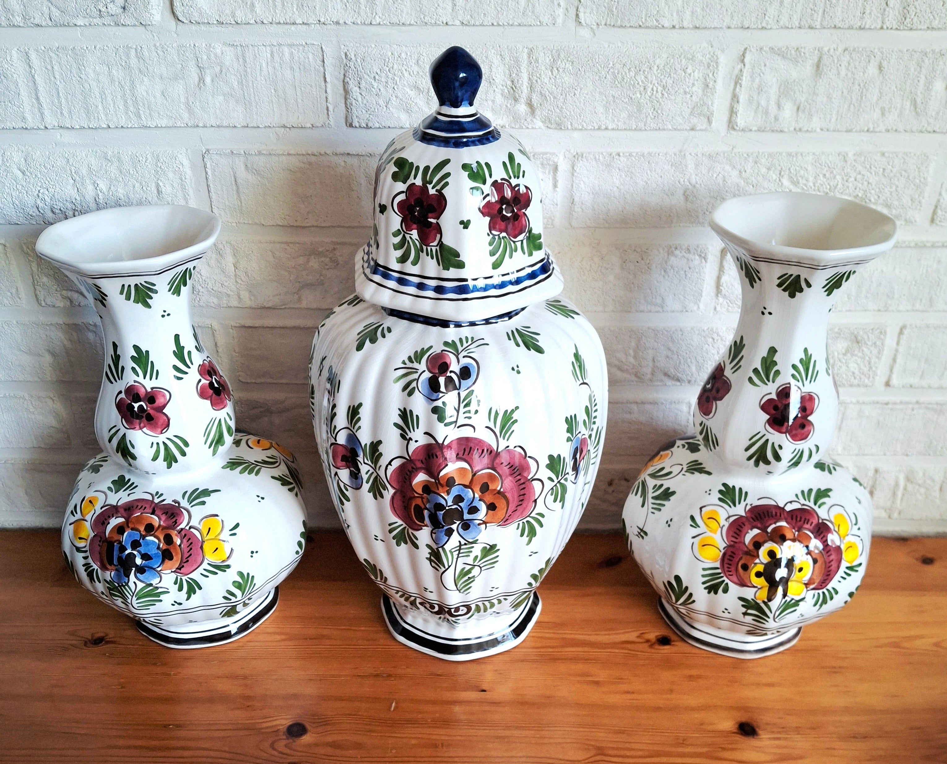 Three hand-painted Delft porcelain vases, cabinet set with colored floral pattern, Delft Earthenware Holland