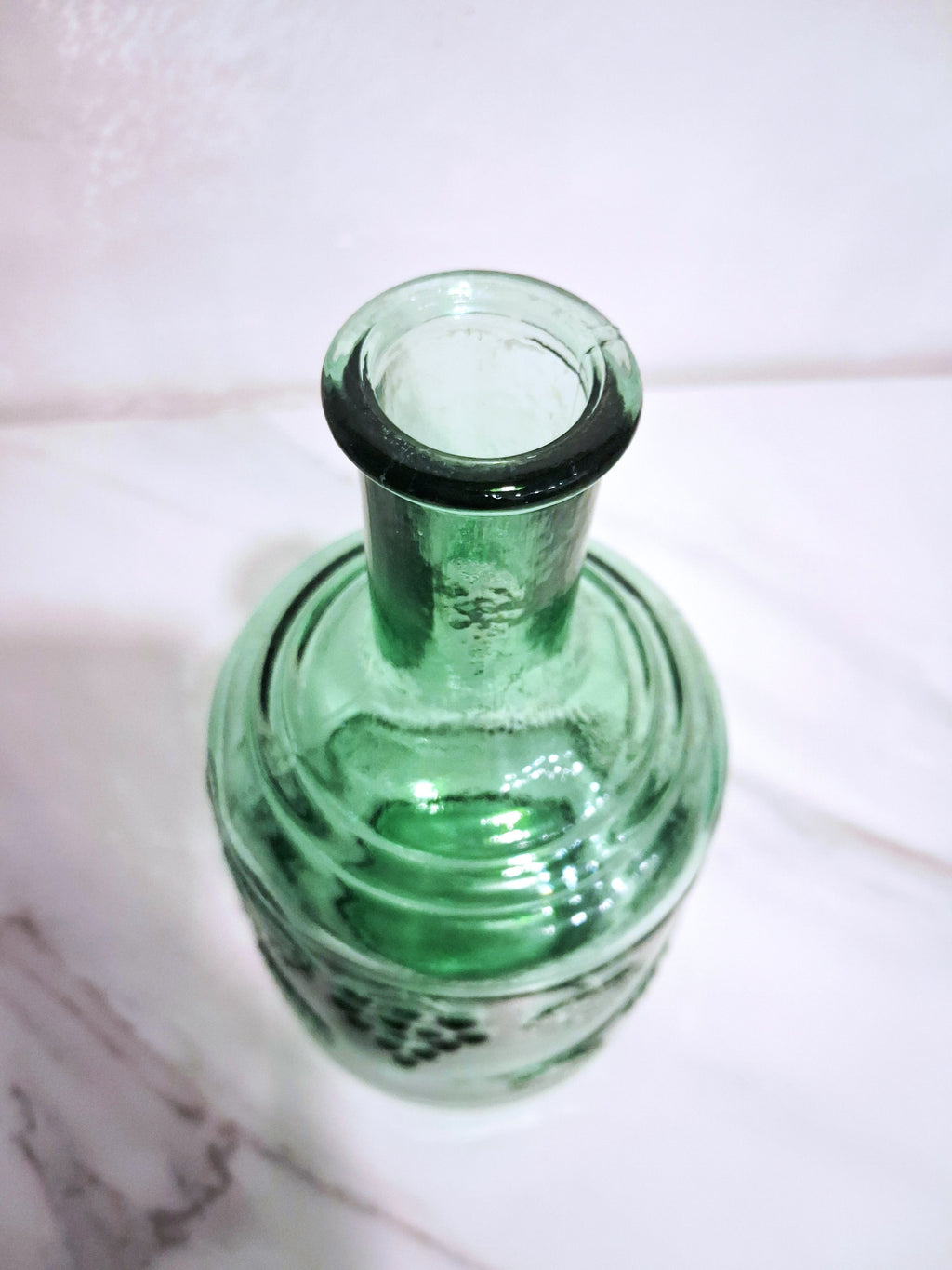 Pair of green glass Decanters with stoppers, Embossed grape motif