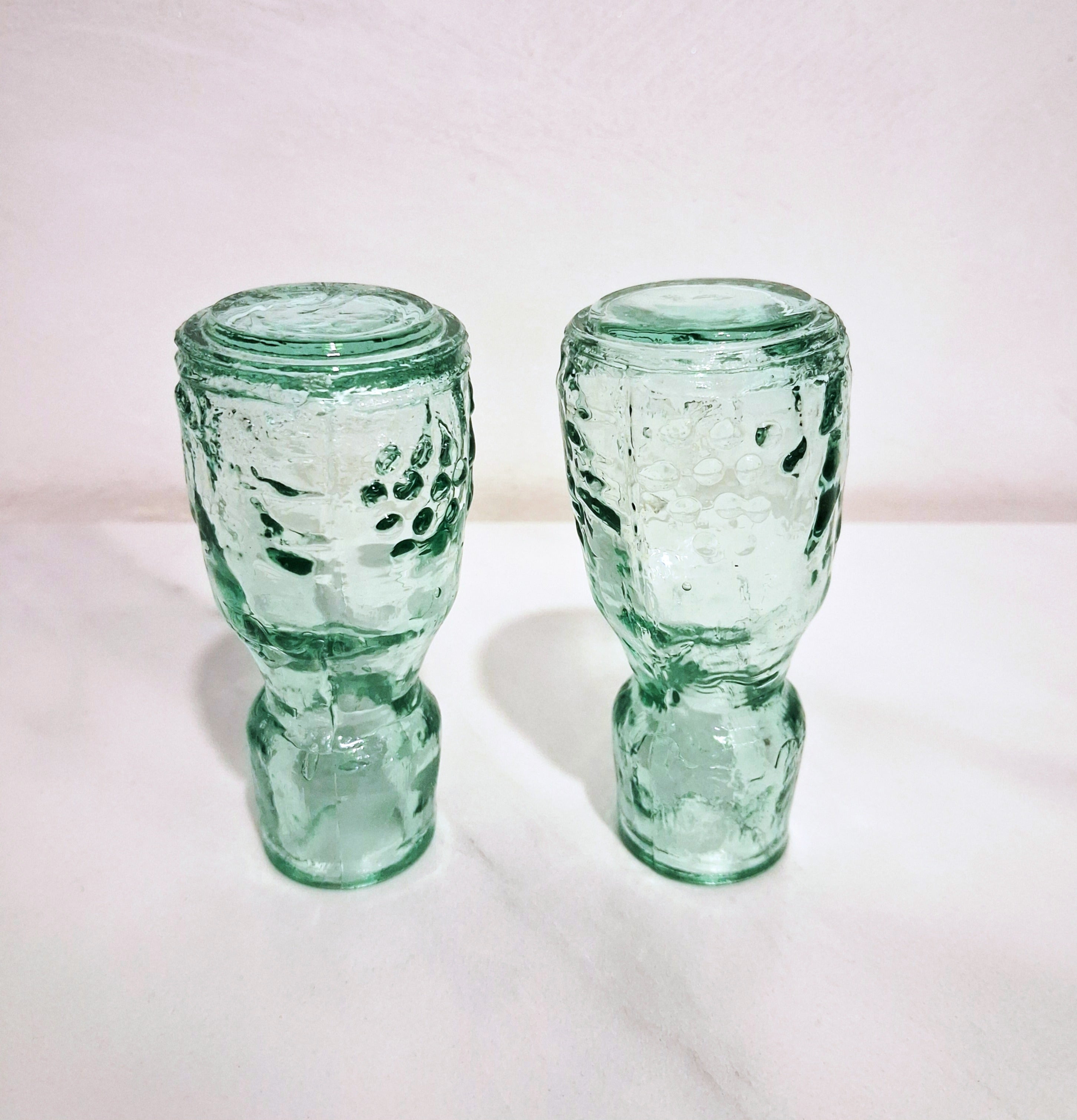Pair of green glass Decanters with stoppers, Embossed grape motif