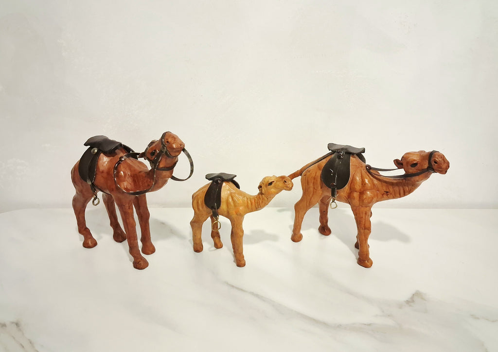 Leather-covered camel figurines set of three