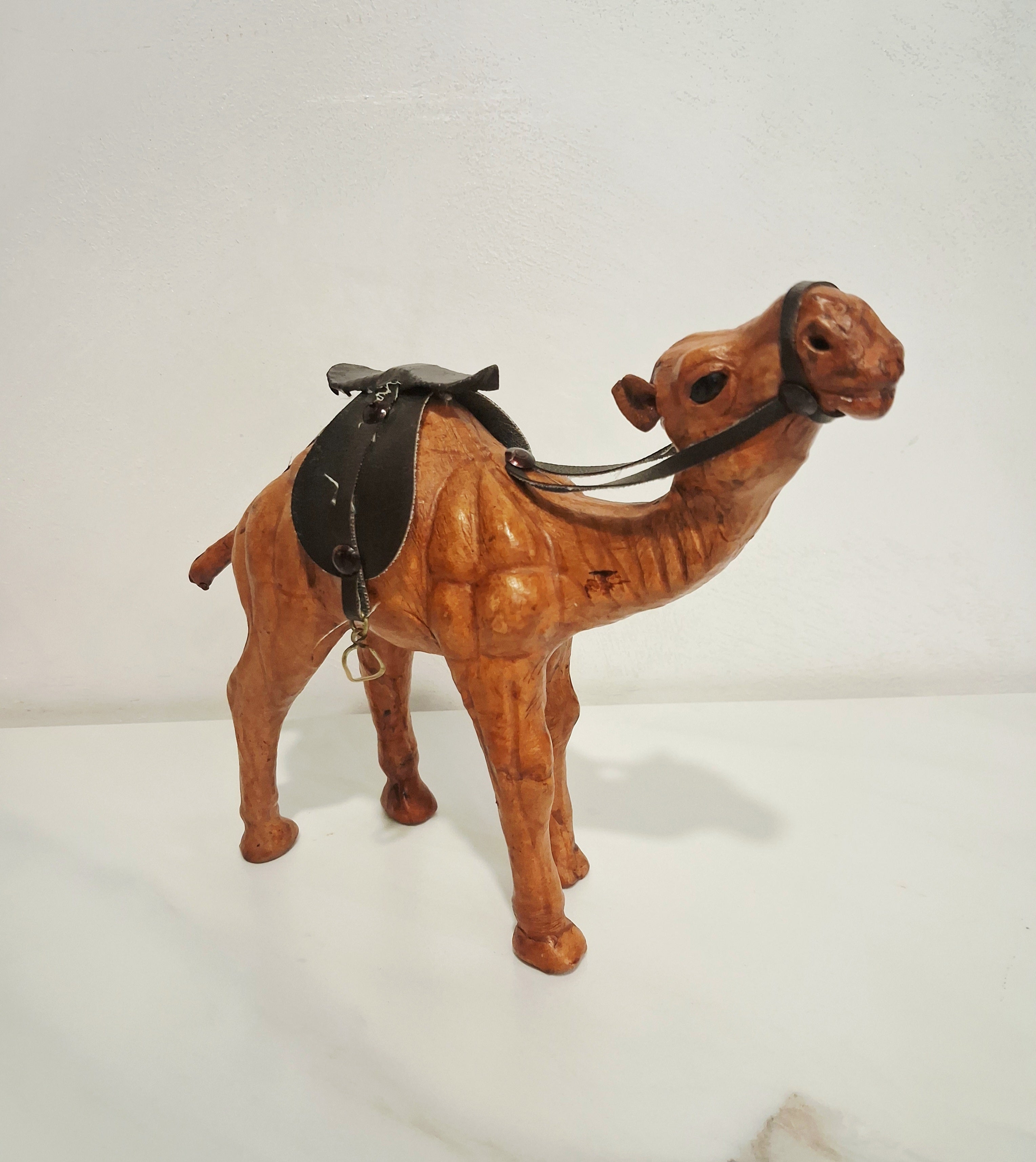 Leather-covered camel figurines set of three