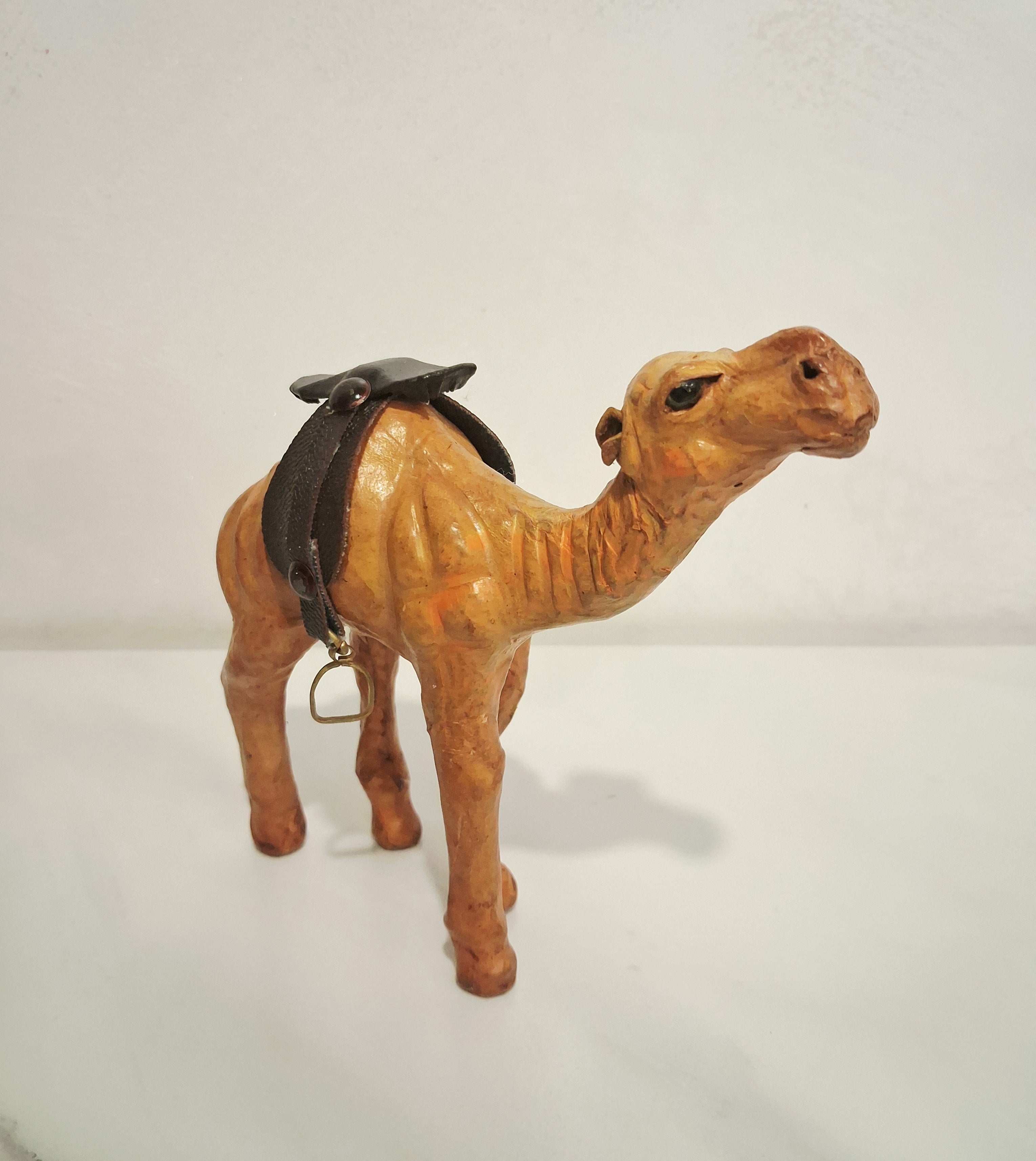 Leather-covered camel figurines set of three