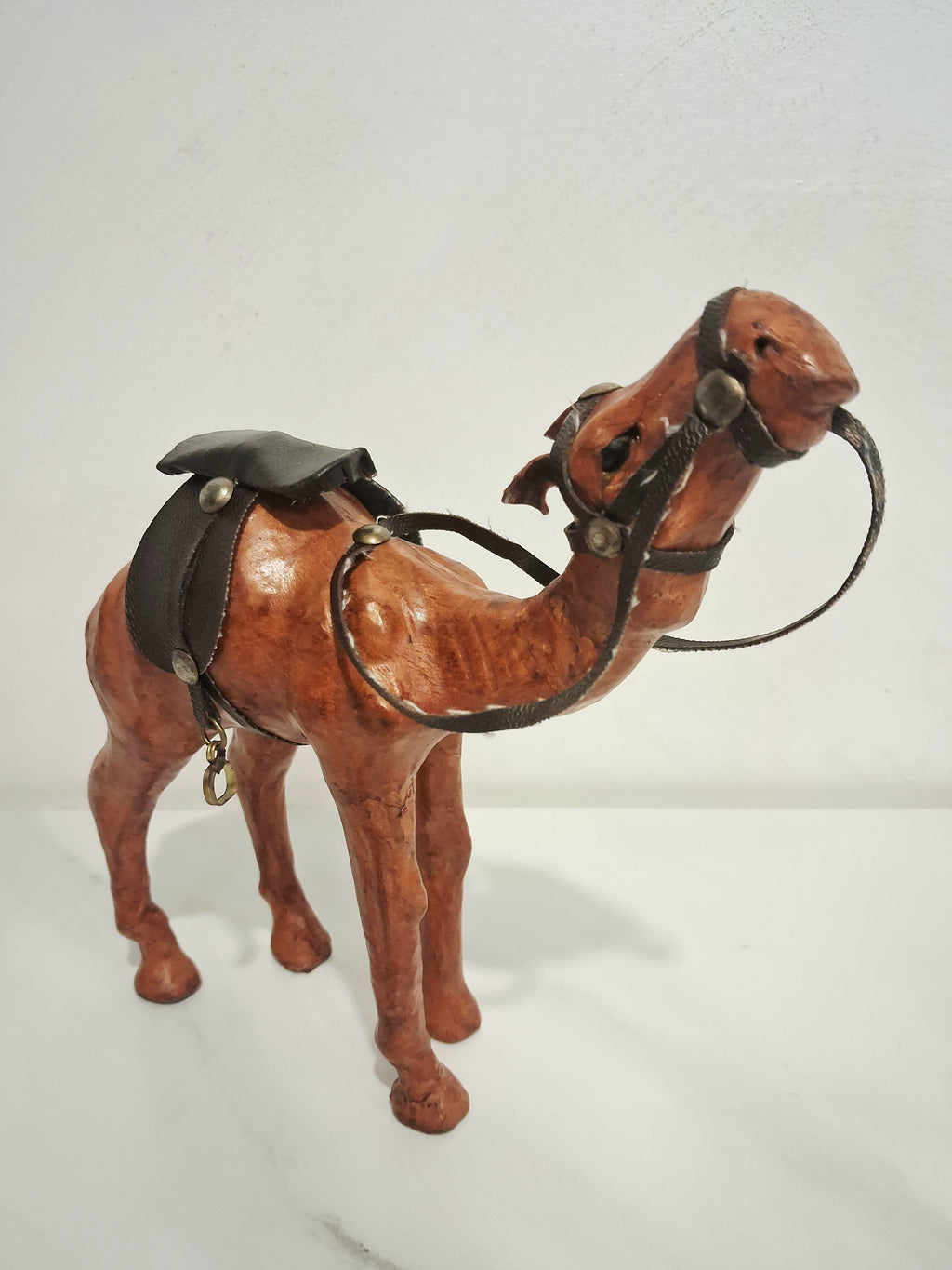 Leather-covered camel figurines set of three