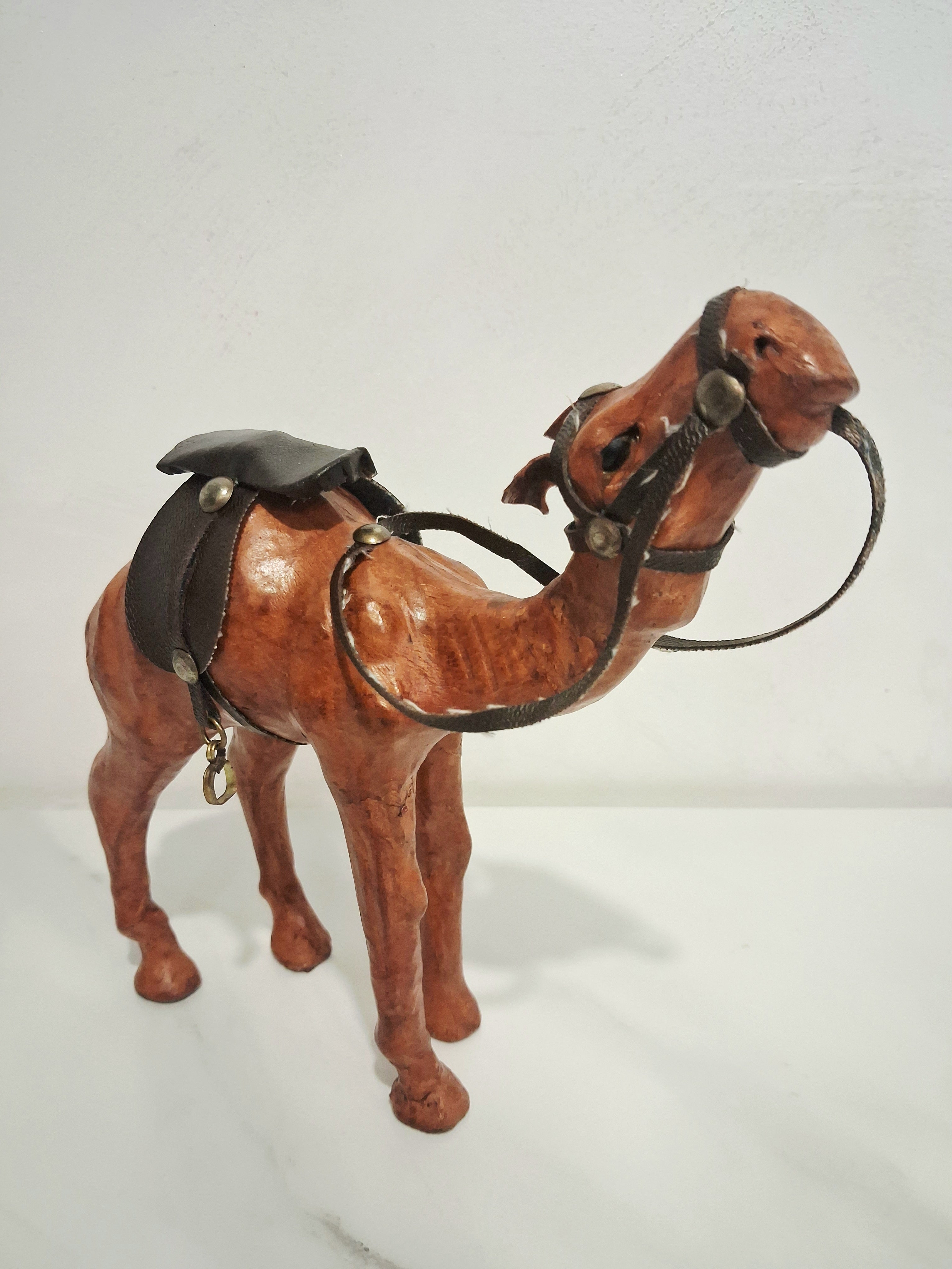Leather-covered camel figurines set of three
