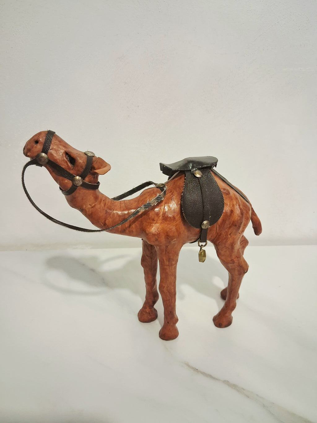 Leather-covered camel figurines set of three