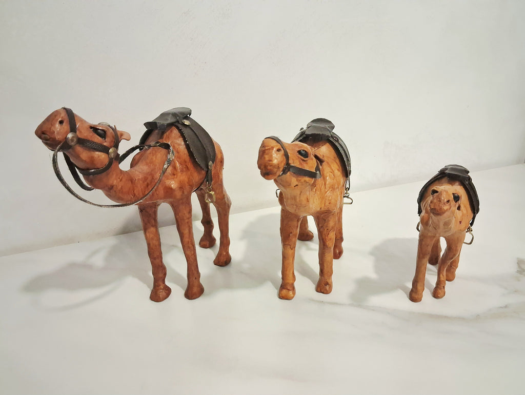 Leather-covered camel figurines set of three