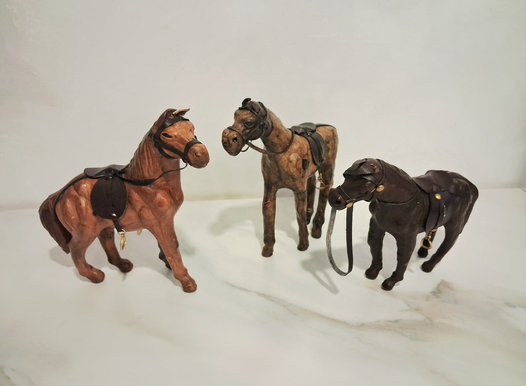 Leather-covered horse figurines set of three
