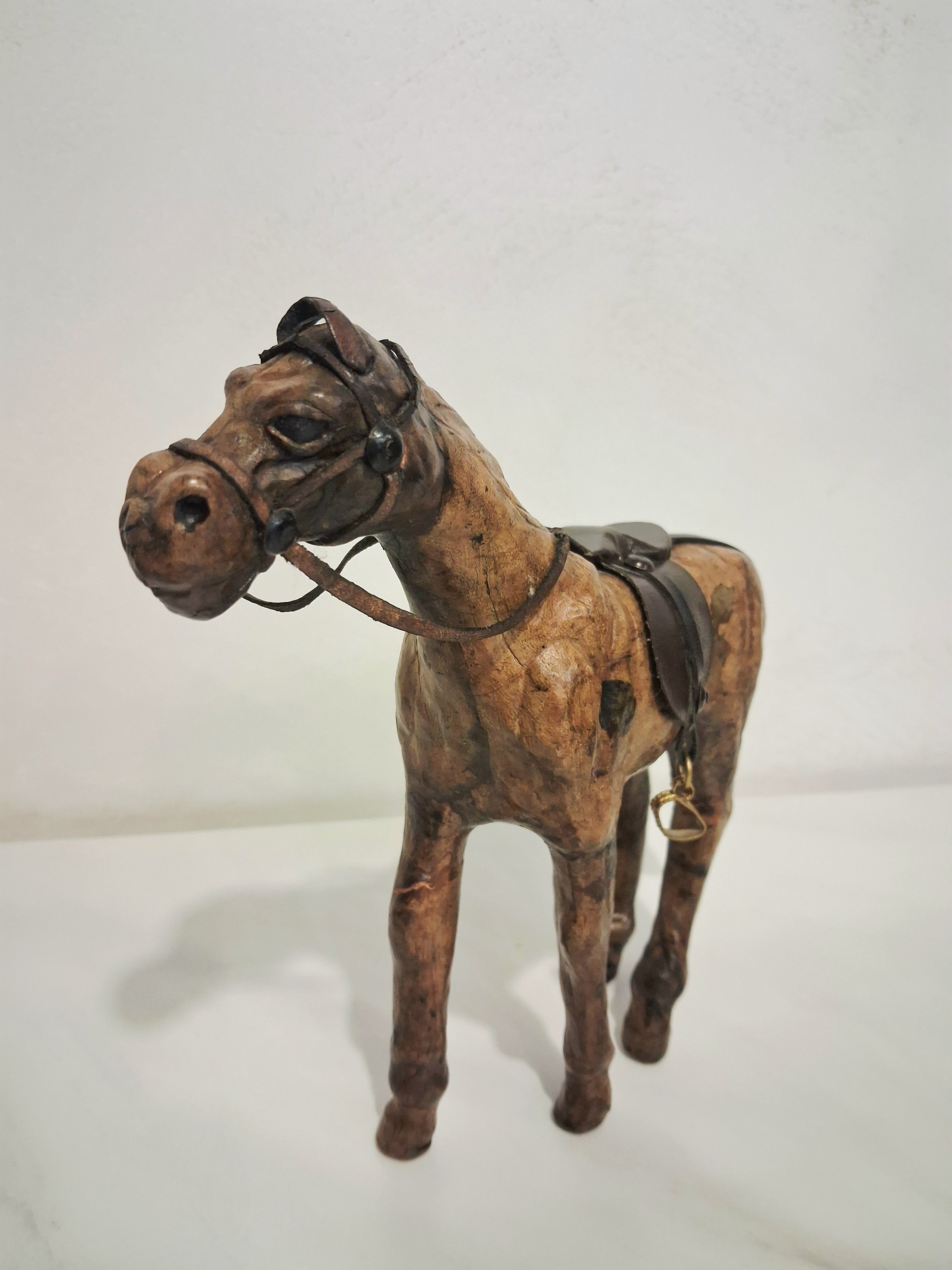 Leather-covered horse figurines set of three