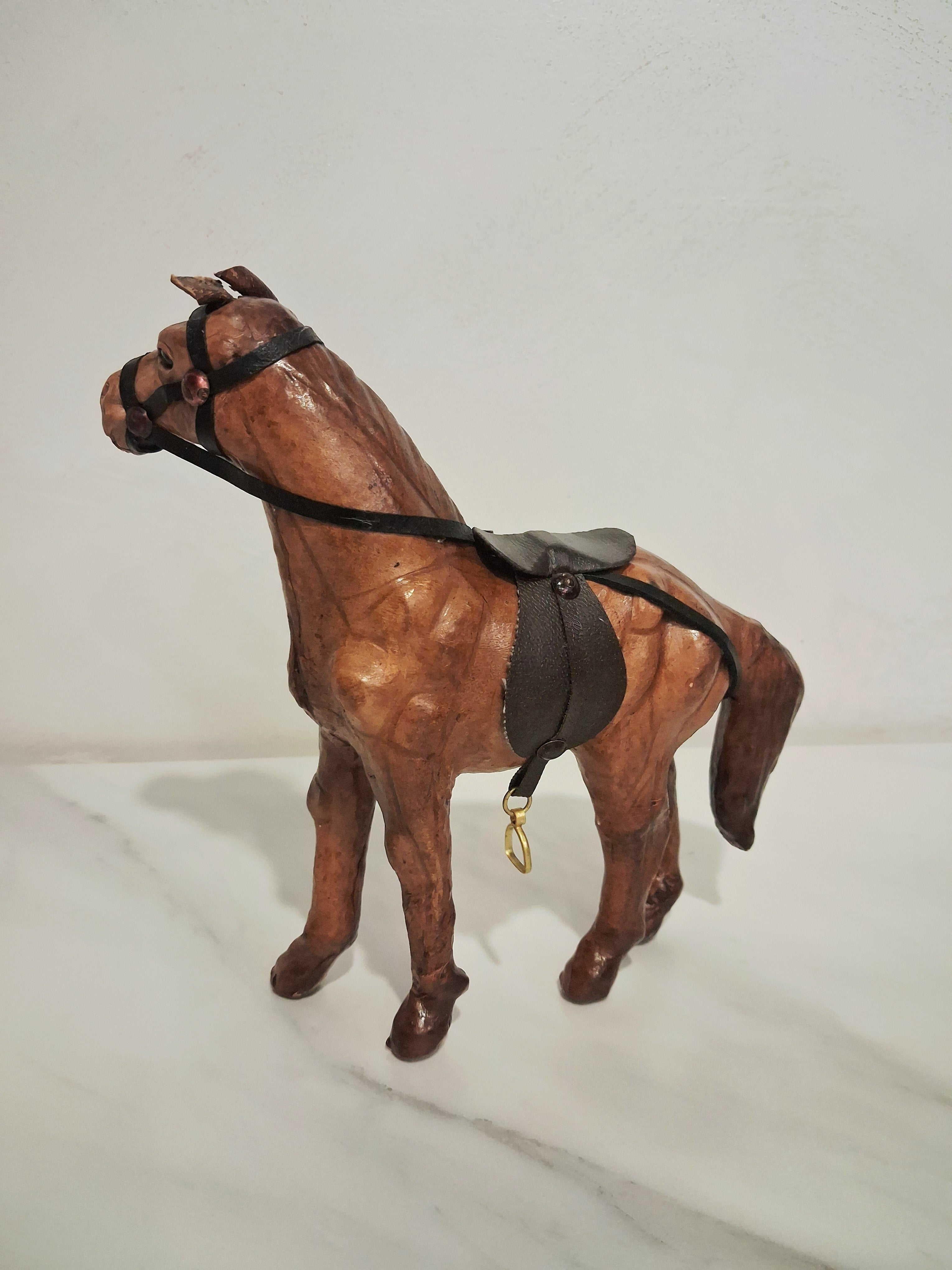 Leather-covered horse figurines set of three