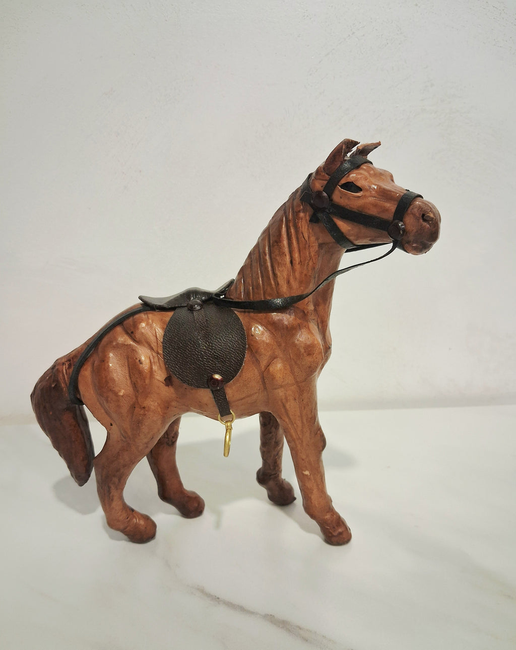 Leather-covered horse figurines set of three