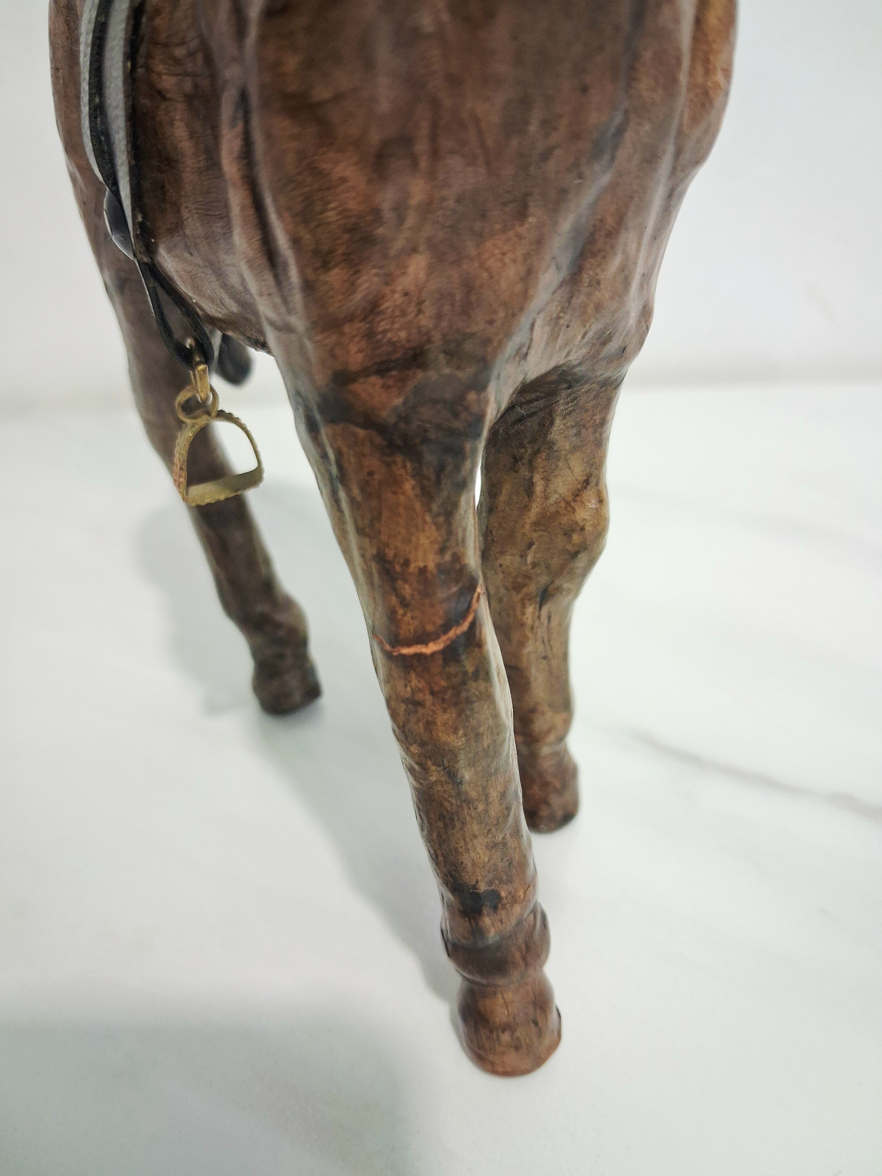 Leather-covered horse figurines set of three