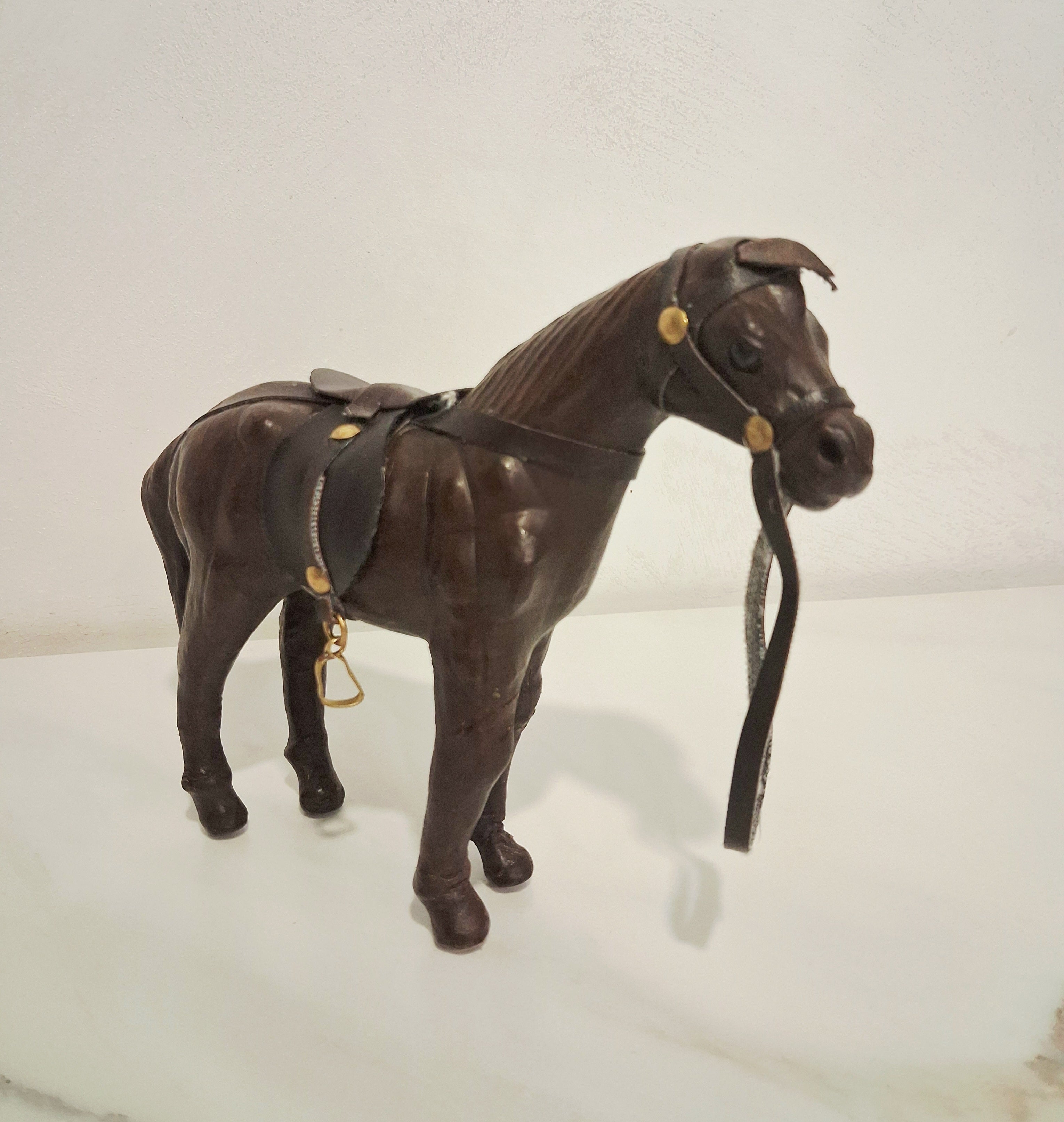 Leather-covered horse figurines set of three
