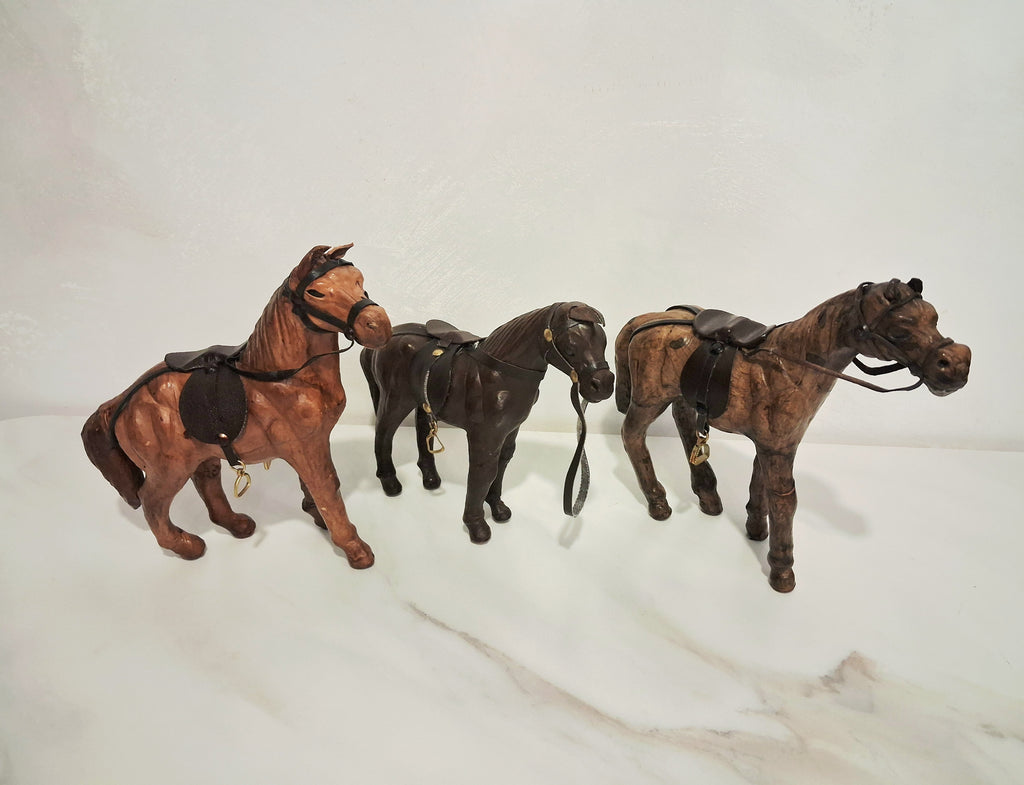 Leather-covered horse figurines set of three