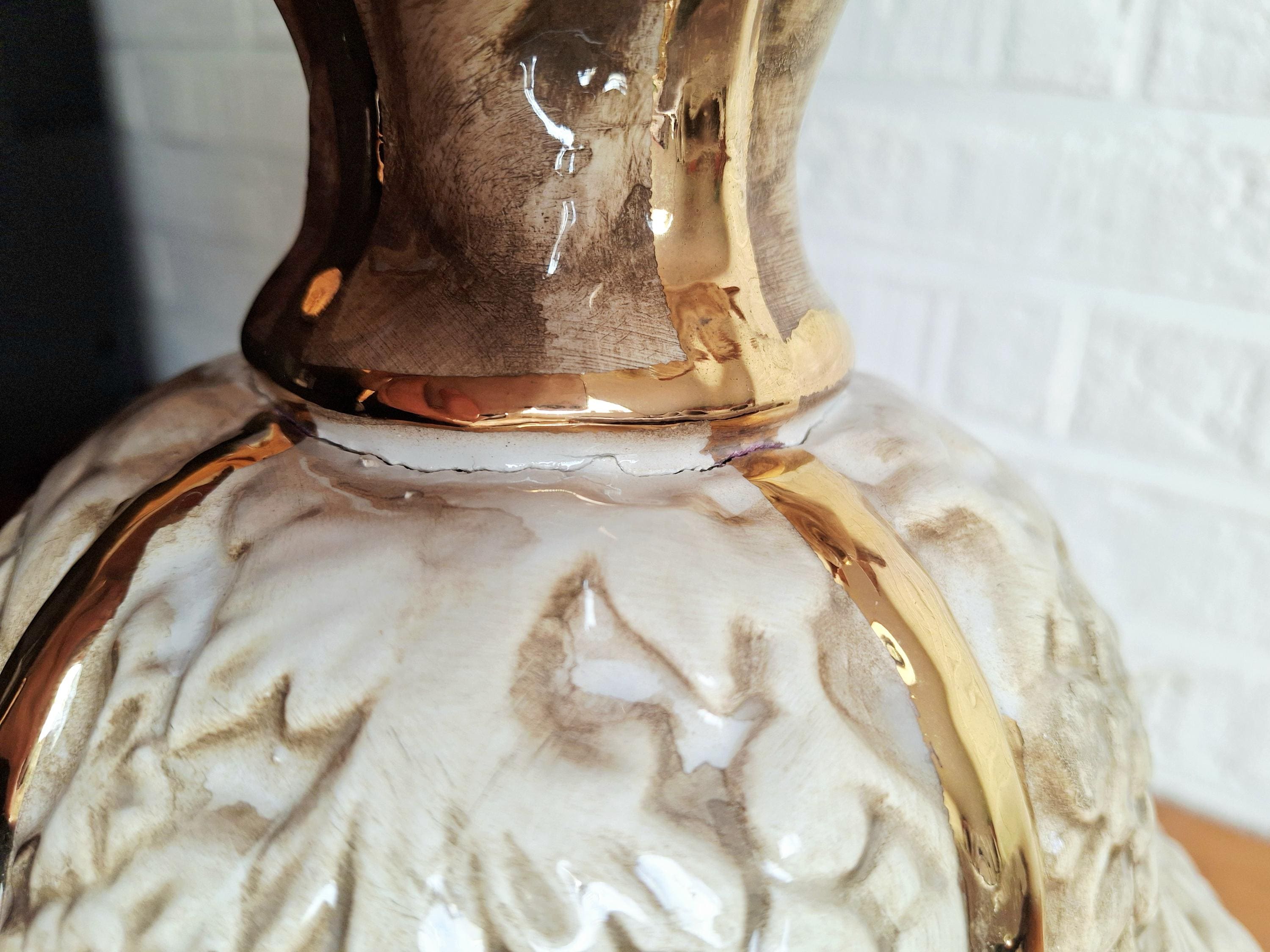 Italian rococo revival lidded vase with floral reliefs and gold accents