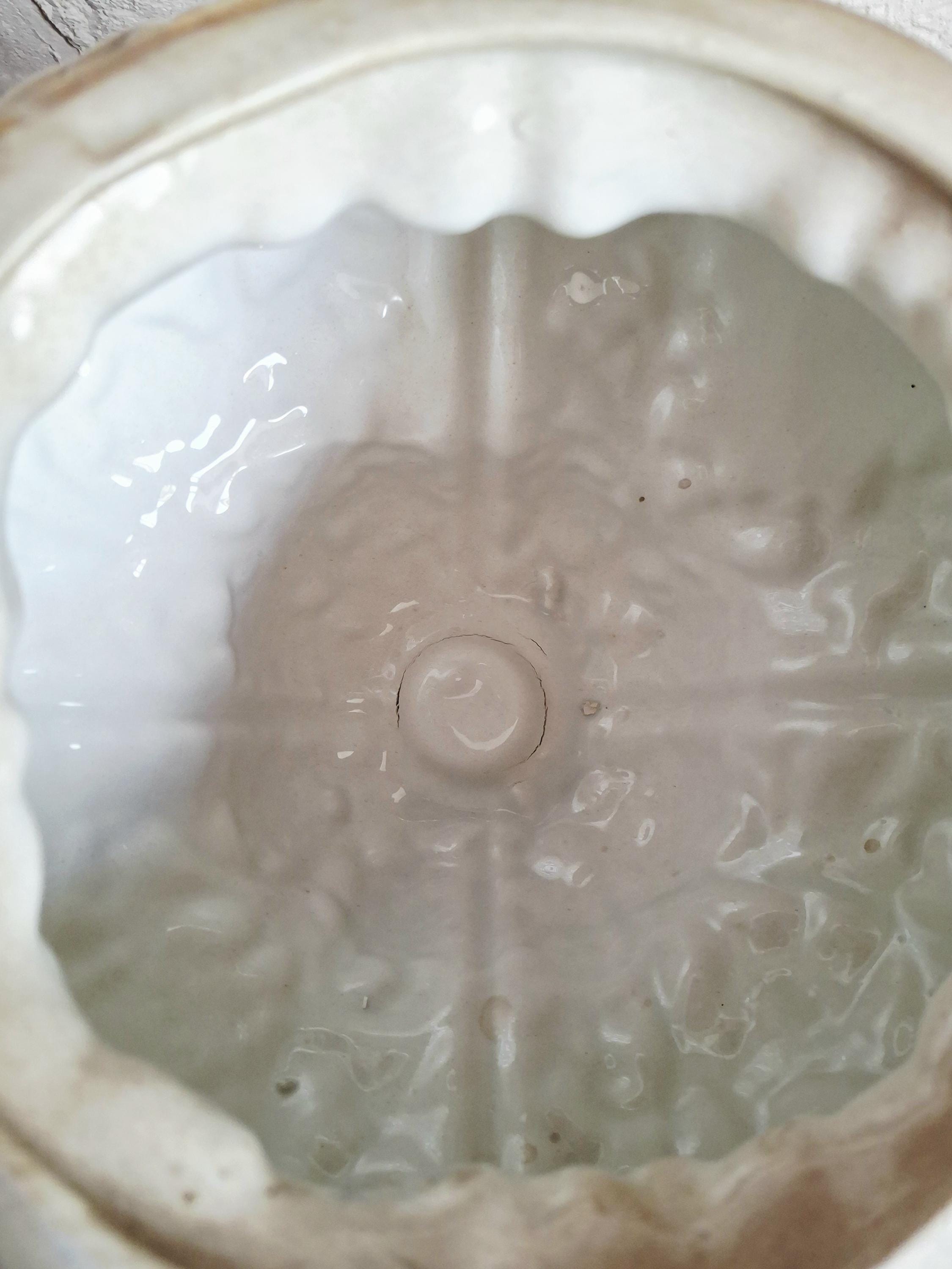 Italian rococo revival lidded vase with floral reliefs and gold accents