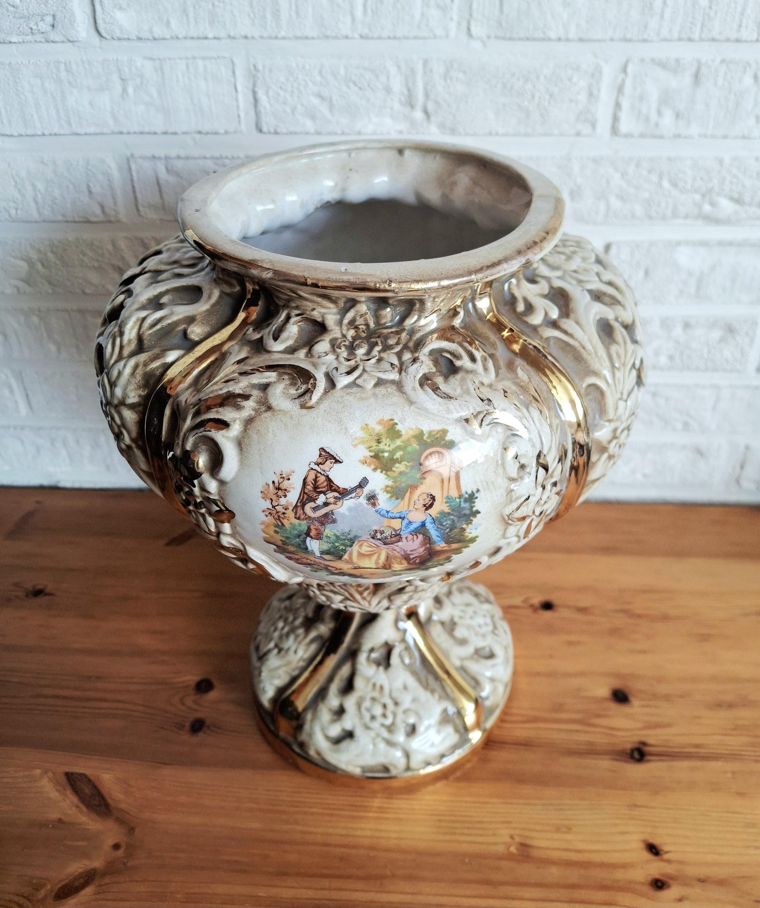 Italian rococo revival lidded vase with floral reliefs and gold accents