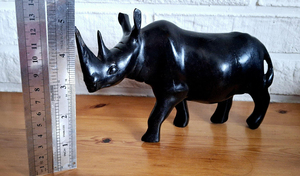 Three African ebony wooden rhino sculptures