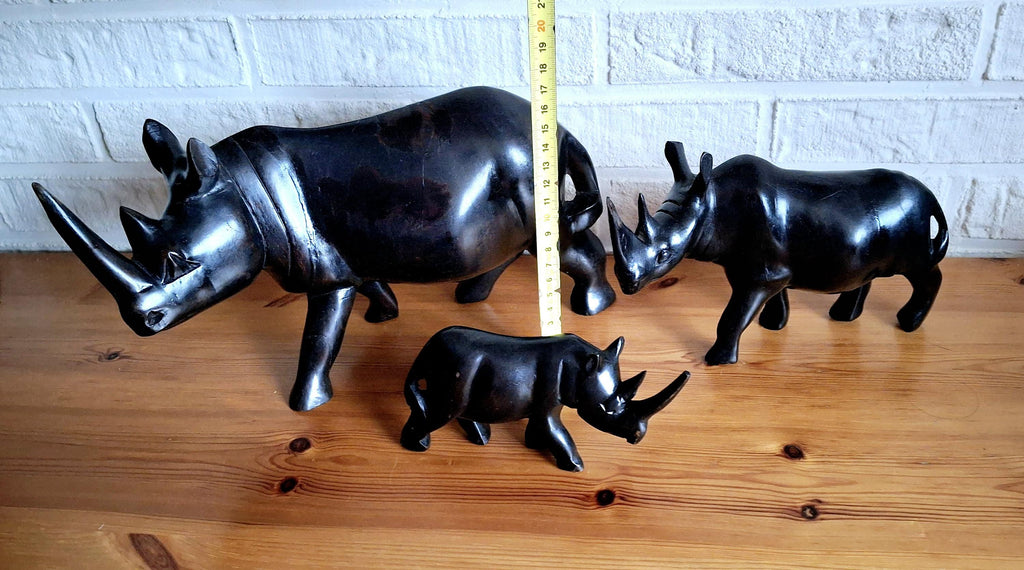 Three African ebony wooden rhino sculptures