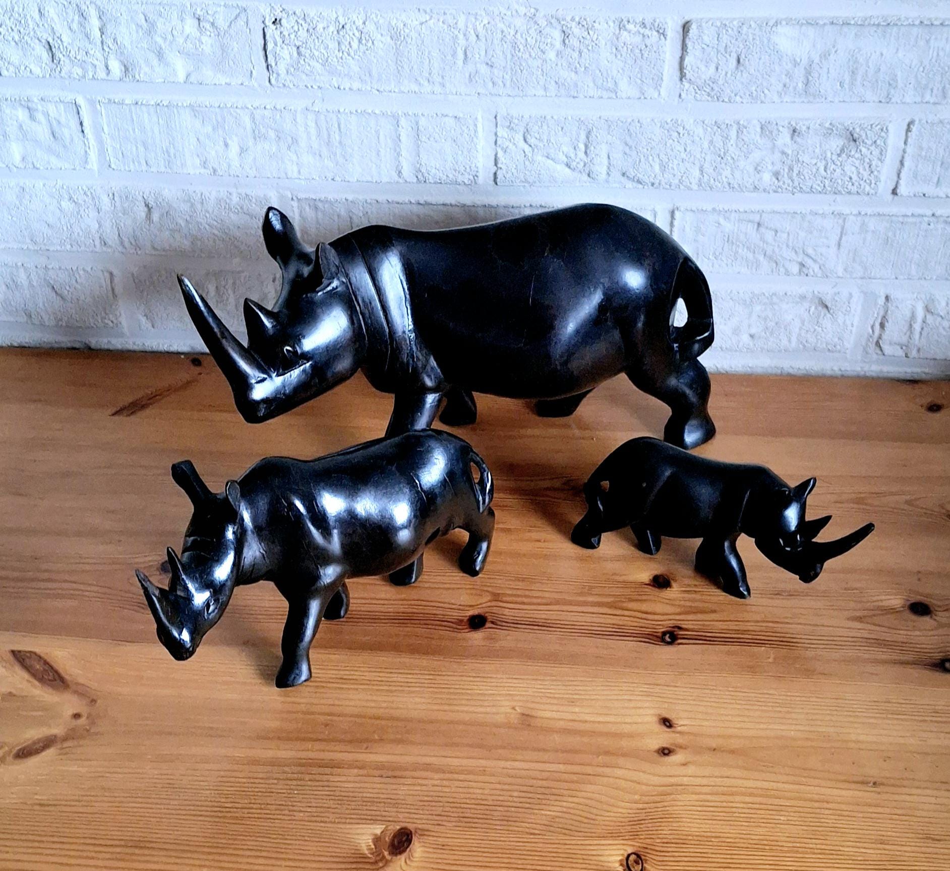 Three African ebony wooden rhino sculptures