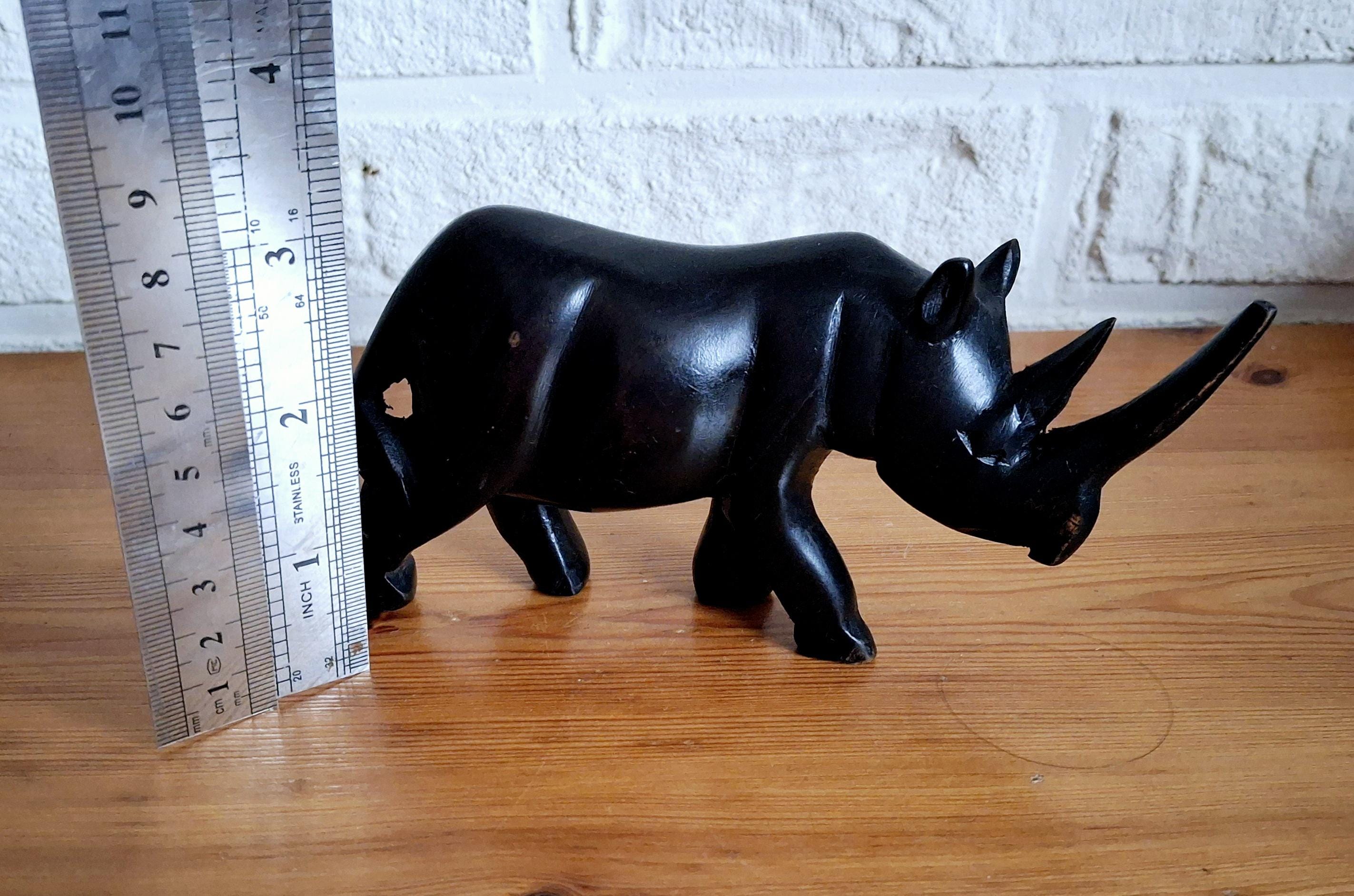 Three African ebony wooden rhino sculptures