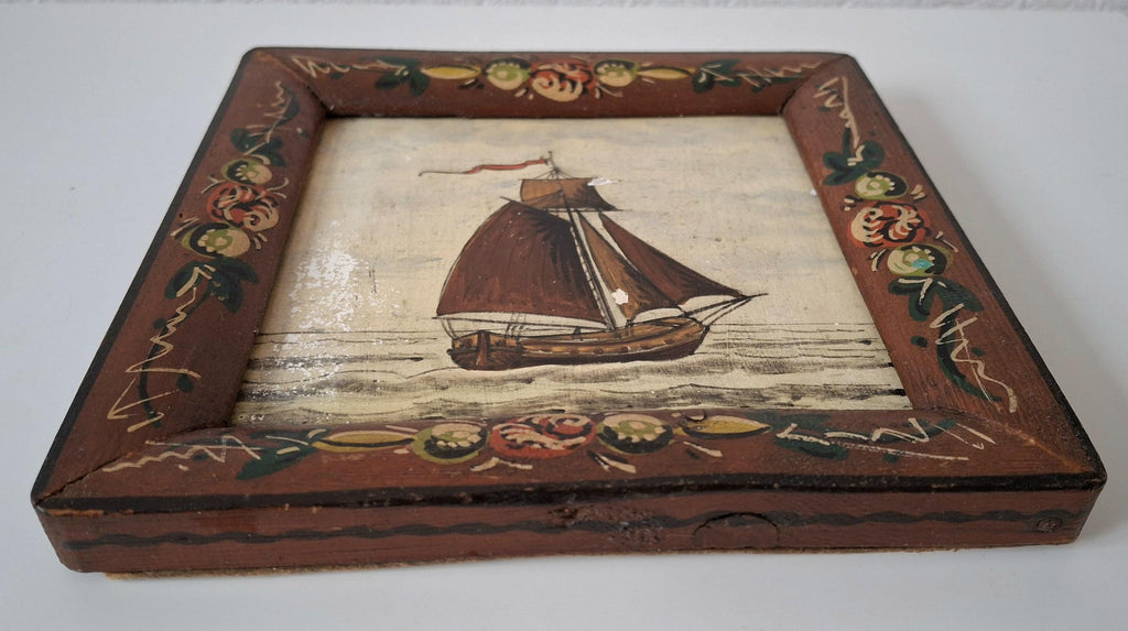 Decorative framed Dutch tile with a sailboat image