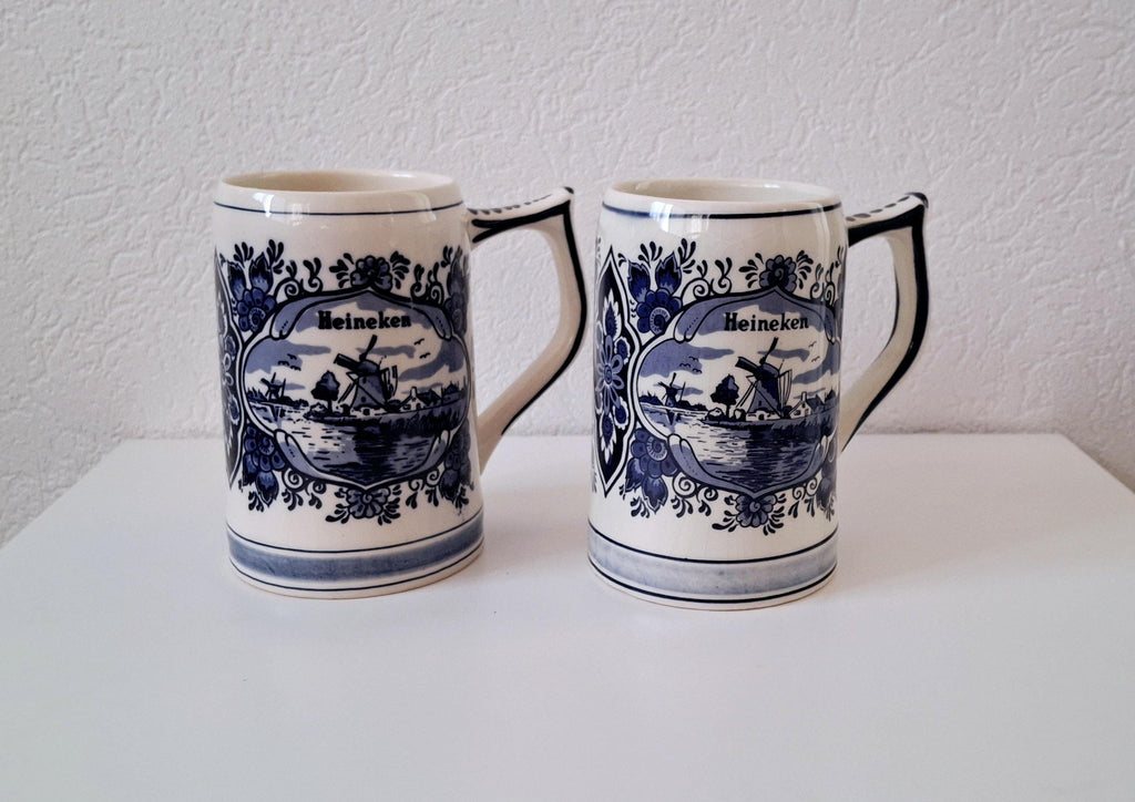Pair of vintage Heineken Delft Blue beer mugs, Dutch beer steins