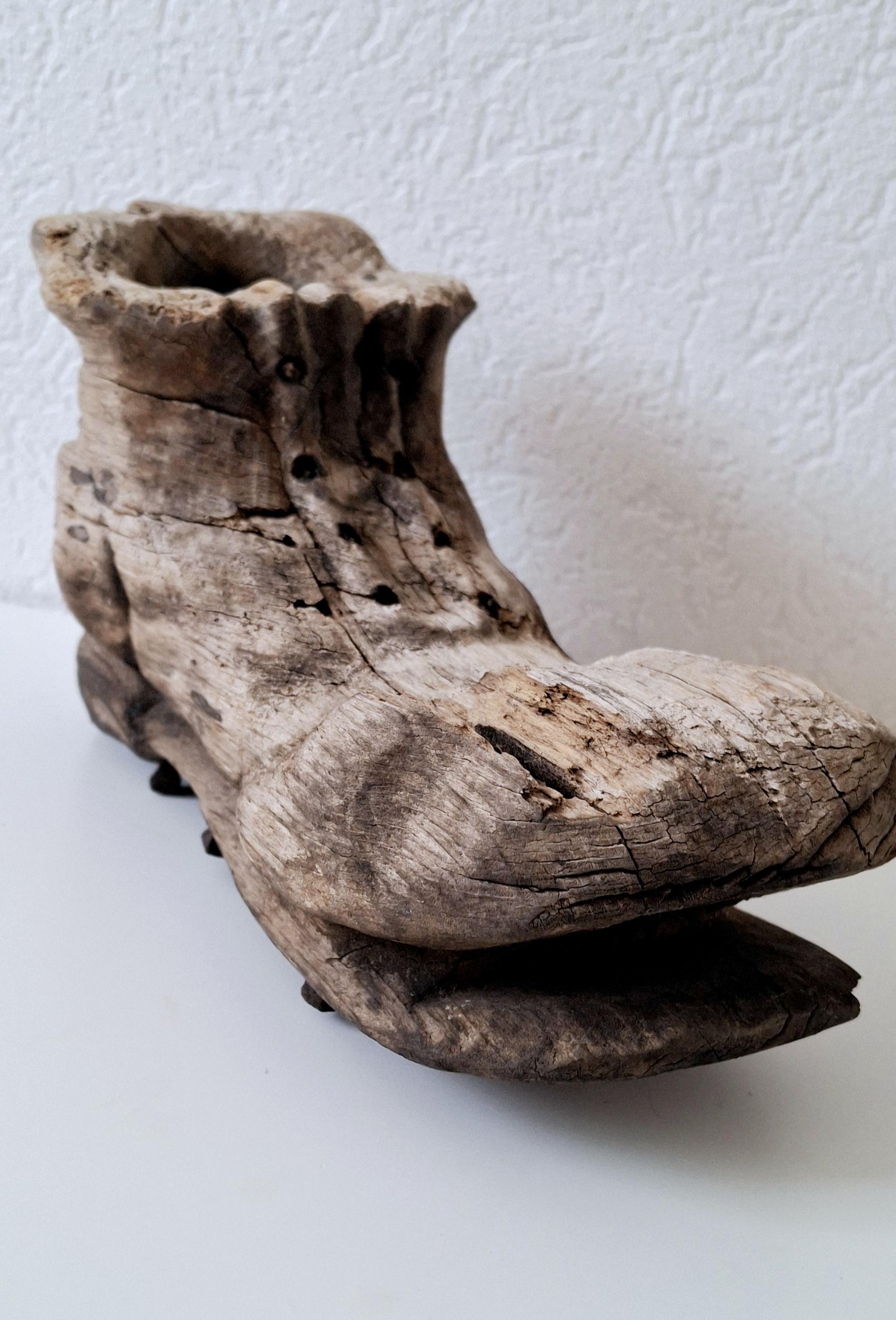 Rustic hand-carved wooden shoe, Vintage folk art with forged nails