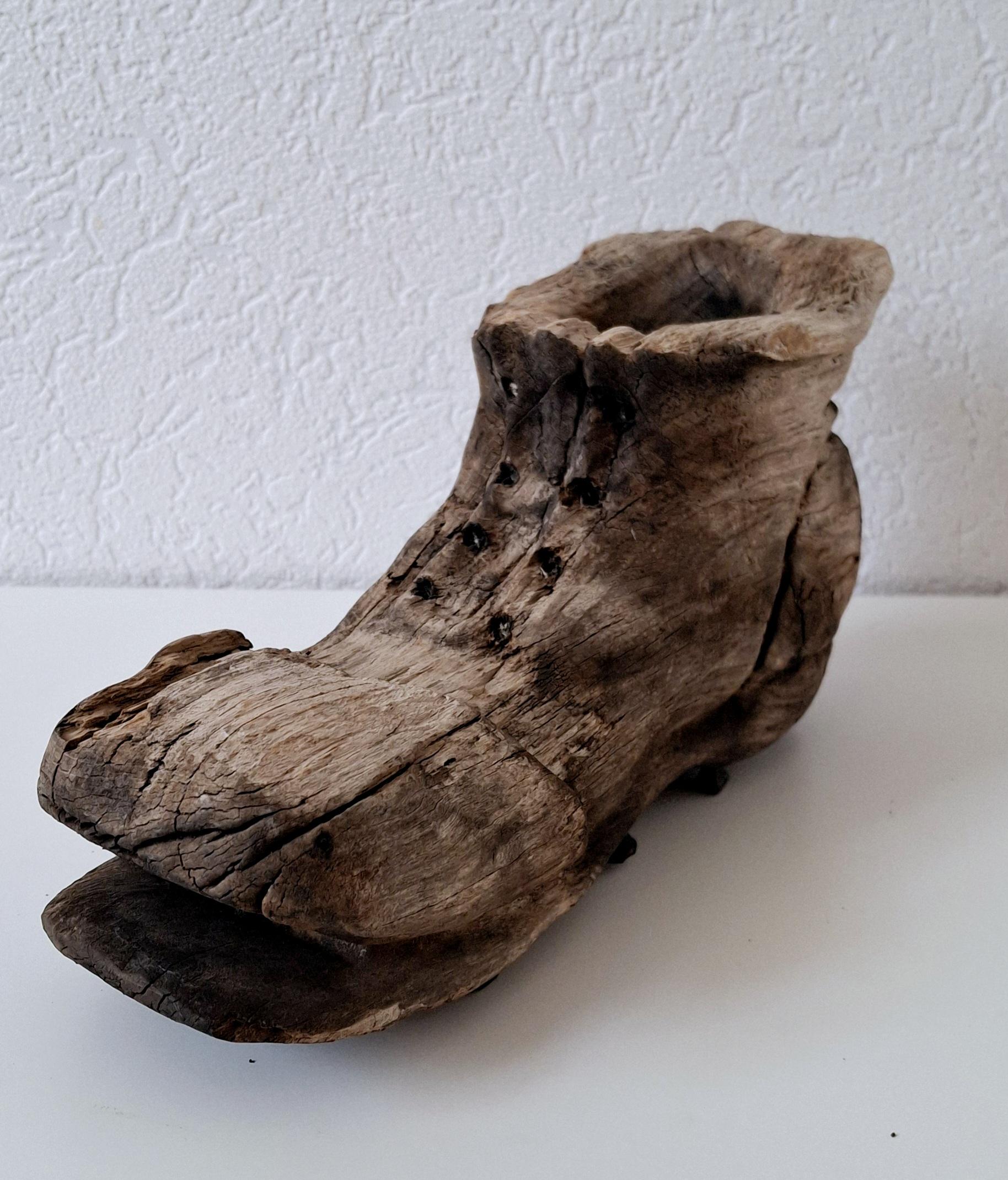 Rustic hand-carved wooden shoe, Vintage folk art with forged nails