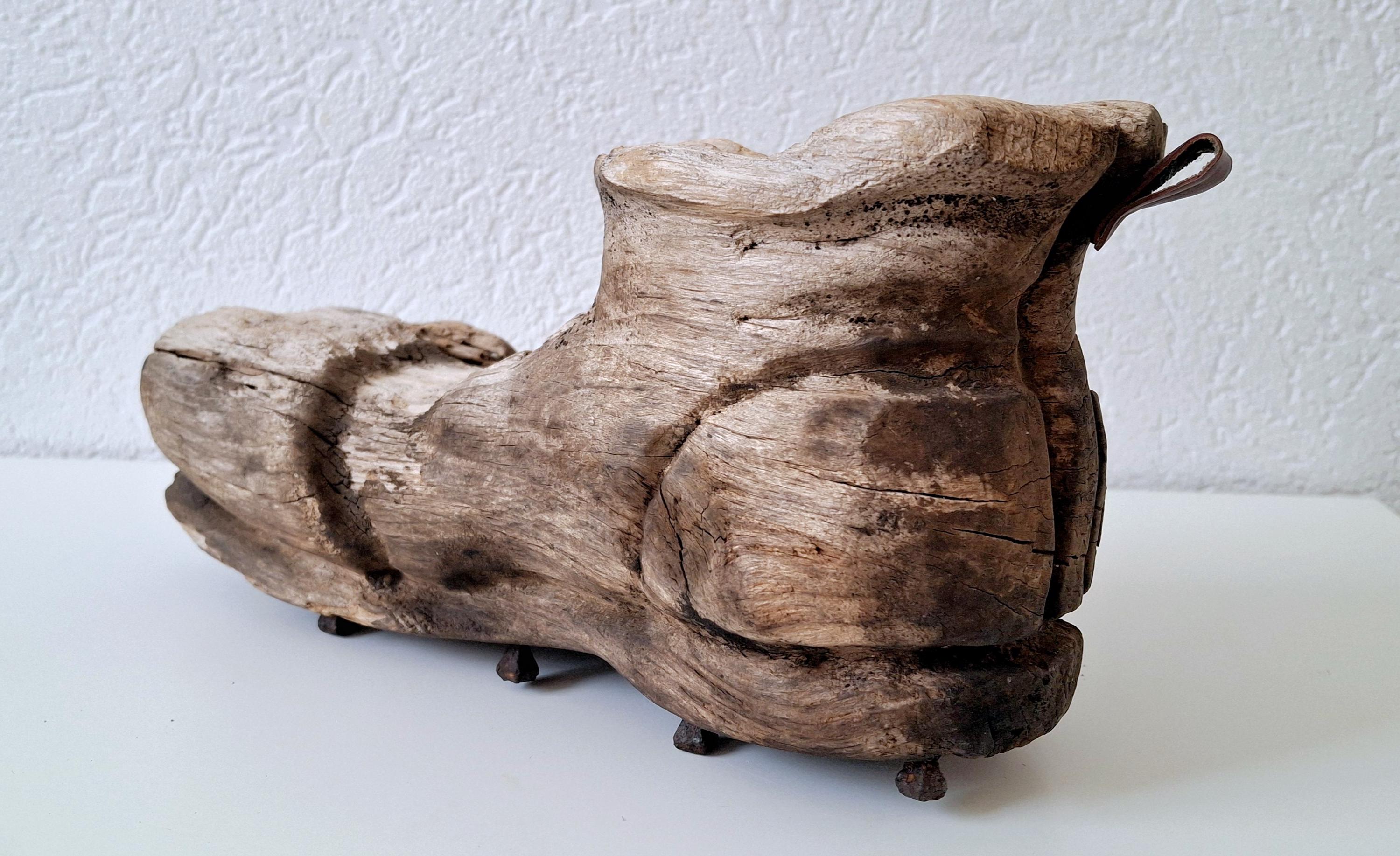 Rustic hand-carved wooden shoe, Vintage folk art with forged nails