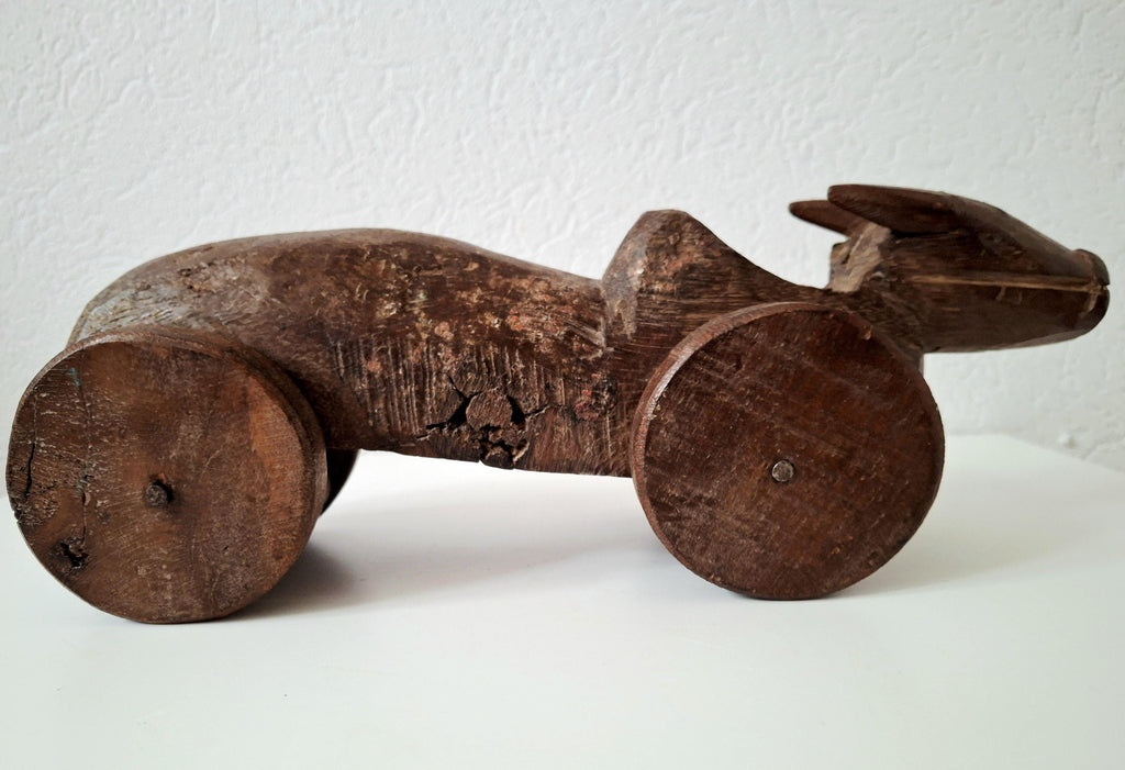 Antique wooden nandi bull toys on wheels