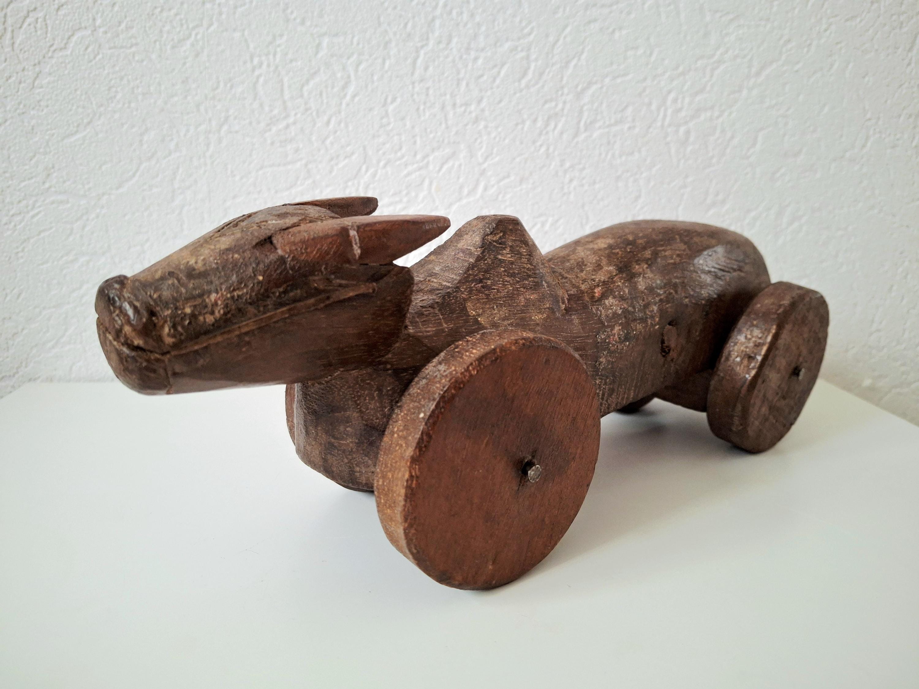 Antique wooden nandi bull toys on wheels