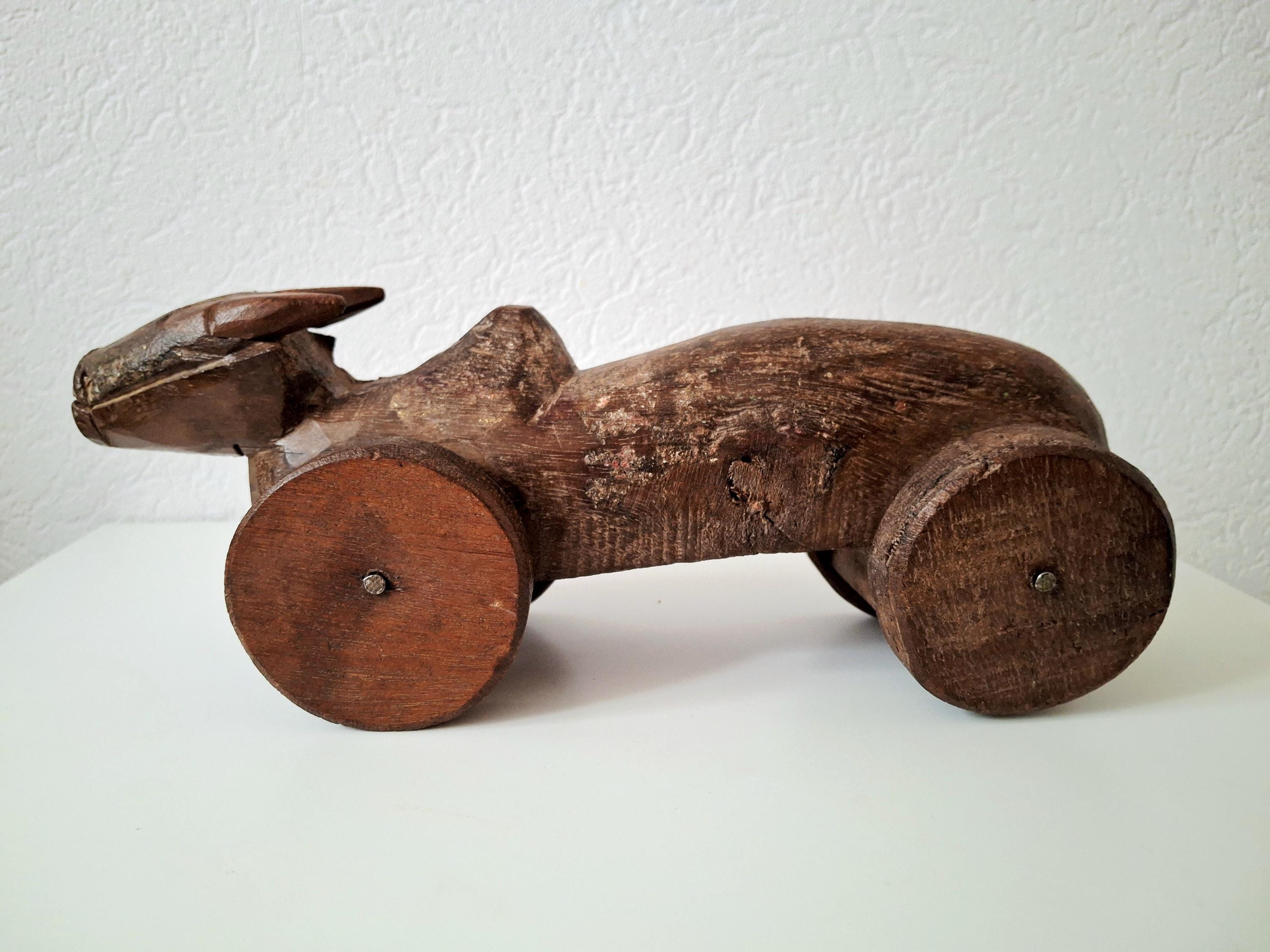 Antique wooden nandi bull toys on wheels
