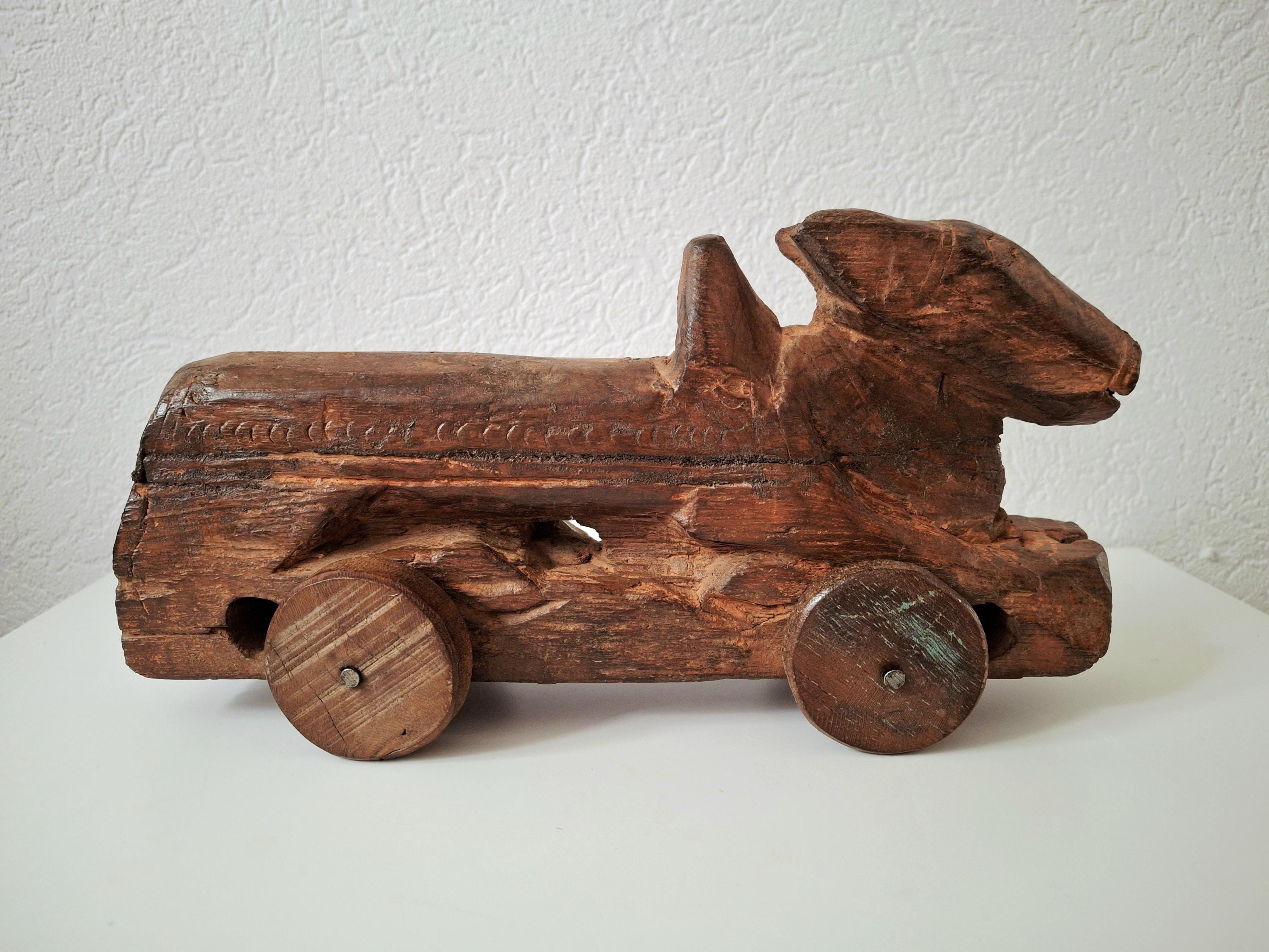 Antique wooden nandi bull toys on wheels