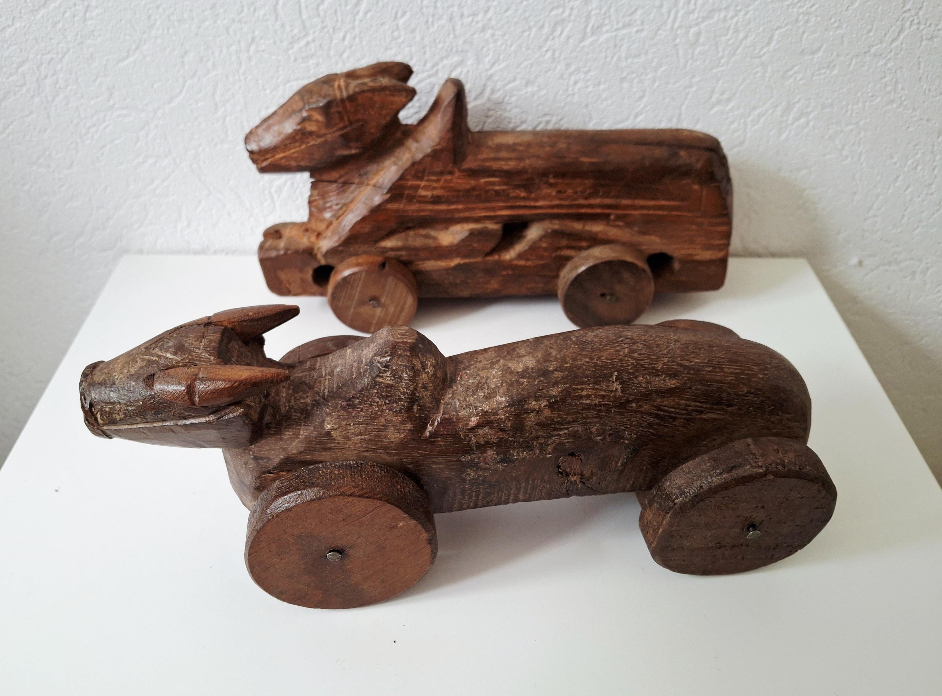 Antique wooden nandi bull toys on wheels